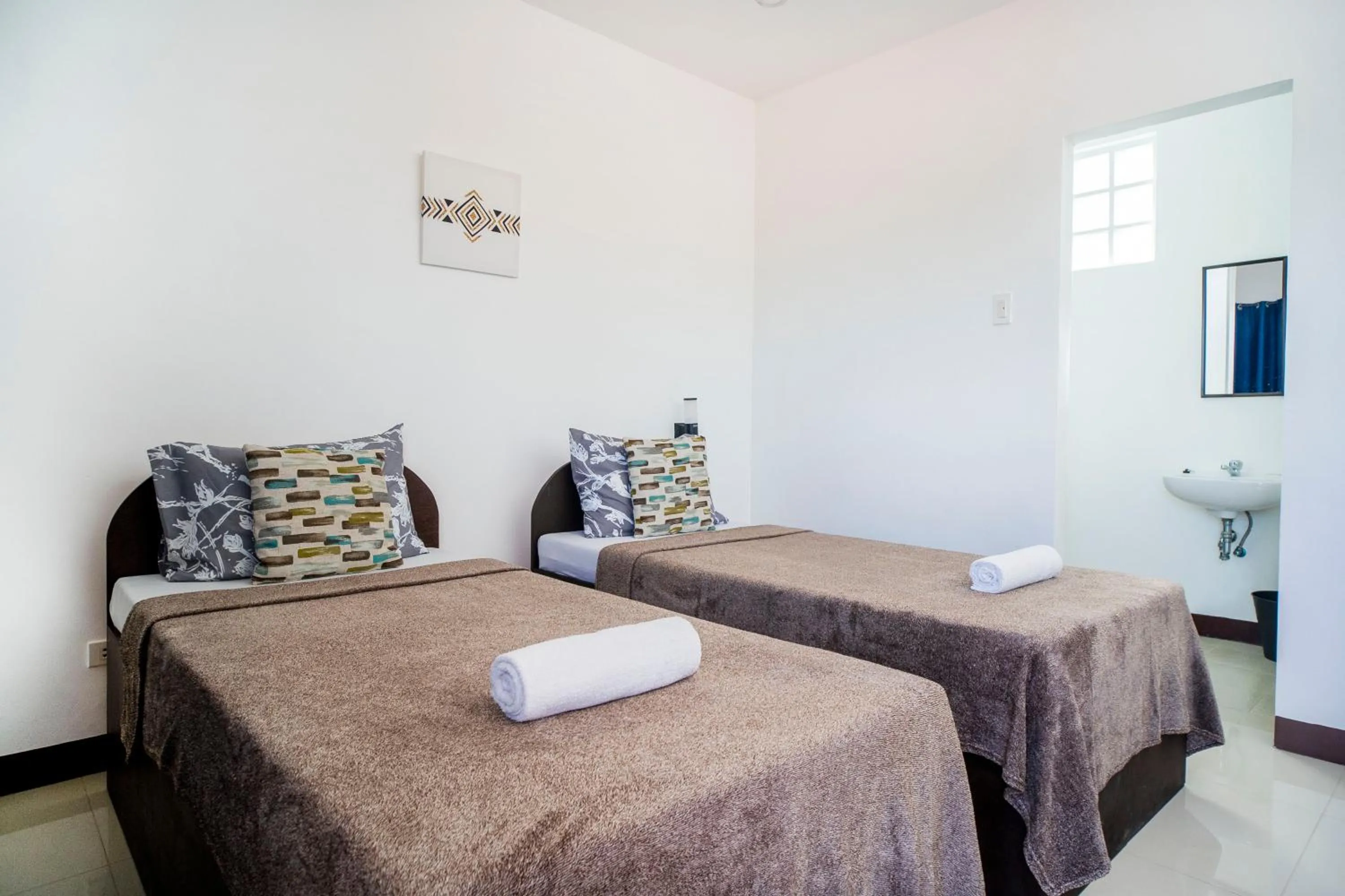 Bed in Panglao Village Court Apartment Stay Inn