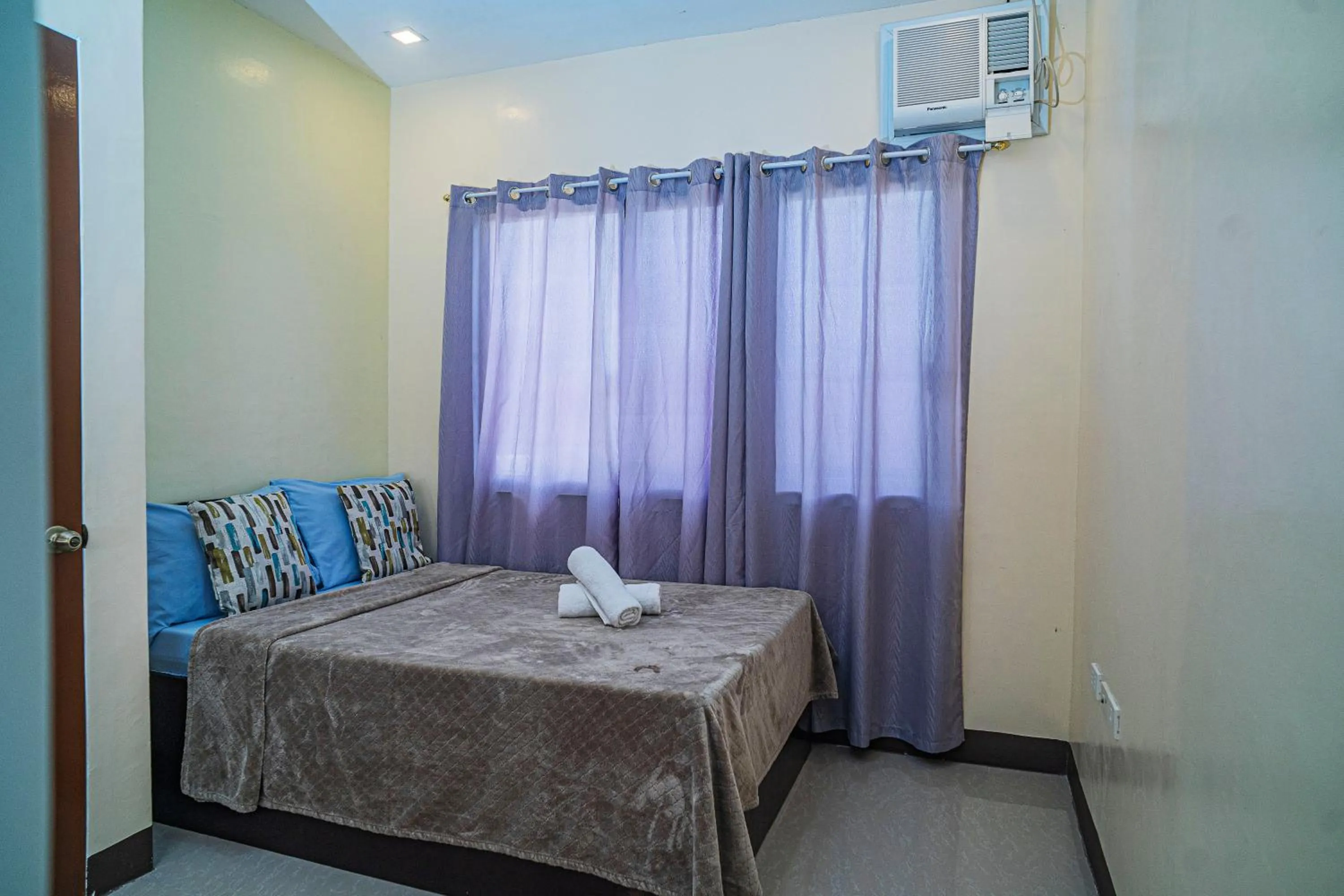 Bed in Panglao Village Court Apartment Stay Inn
