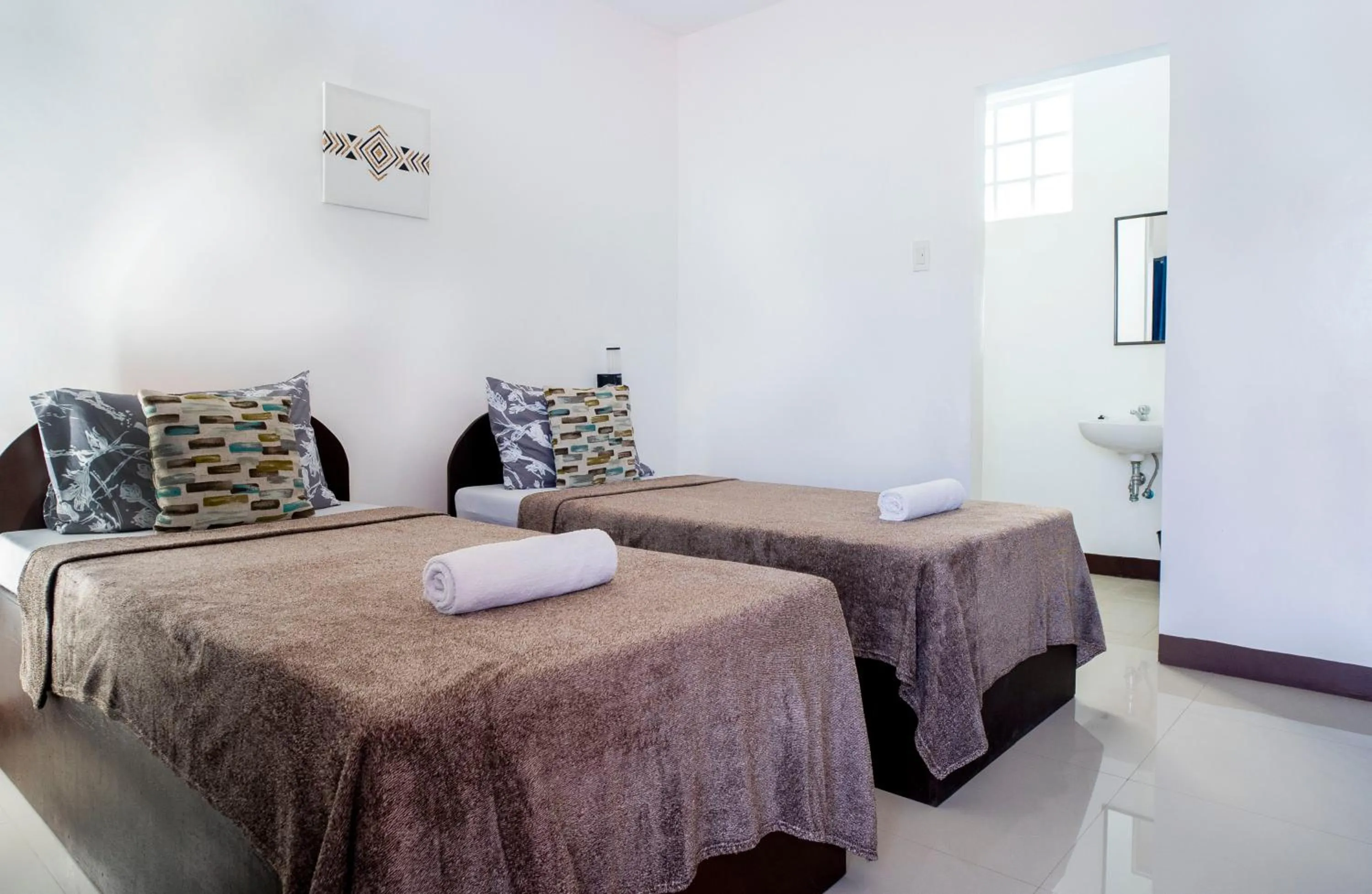 Bed in Panglao Village Court Apartment Stay Inn