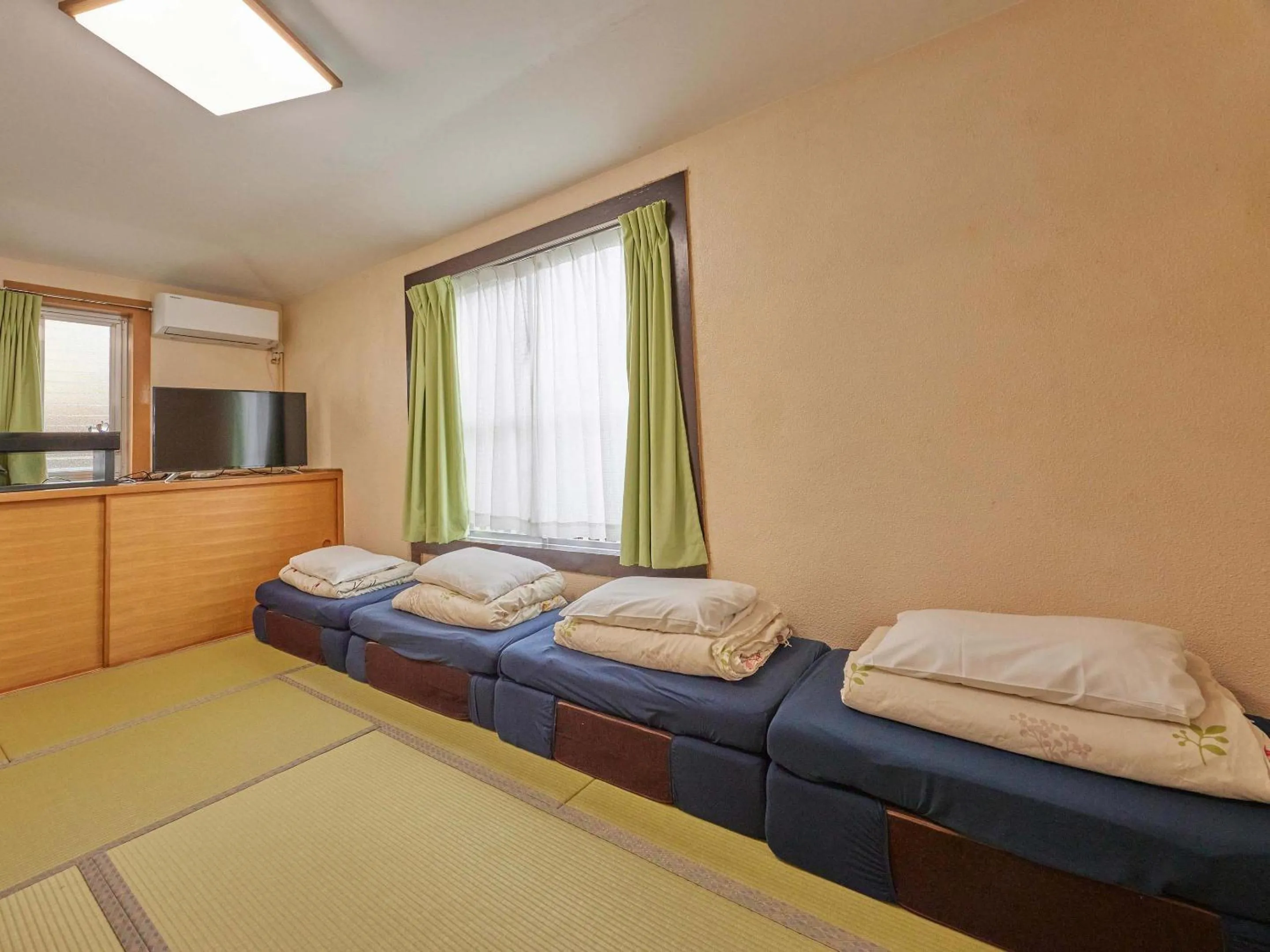 Photo of the whole room, Bed in Yukurina Resort Okinawa