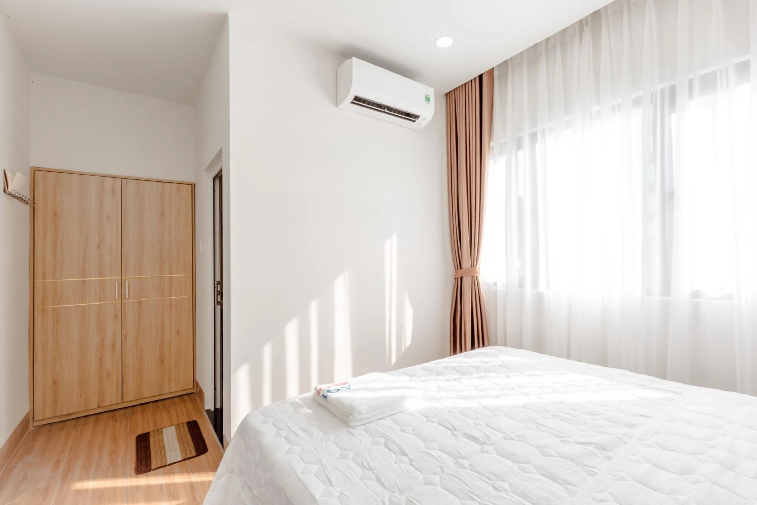 Bed in AQUA Seaview Hotel