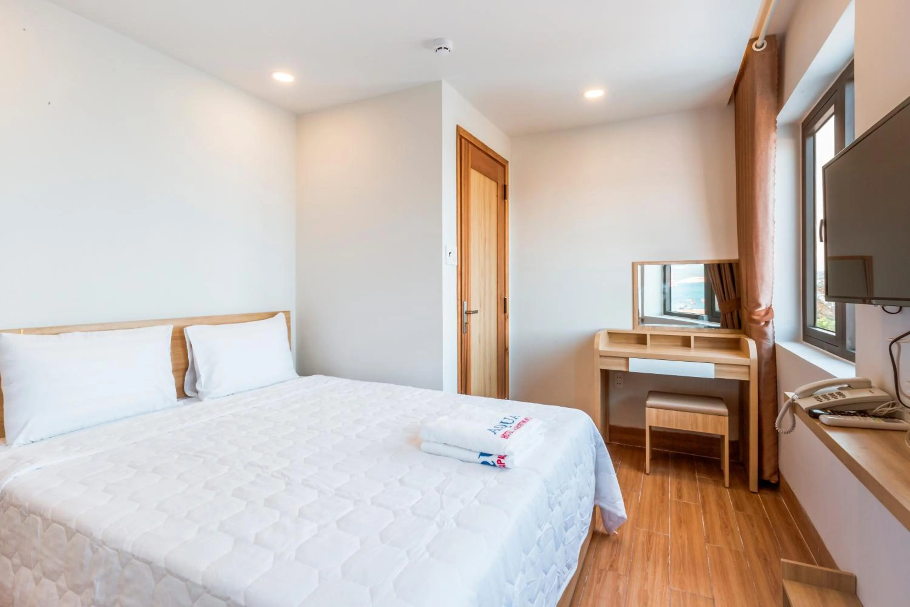 Bed in AQUA Seaview Hotel