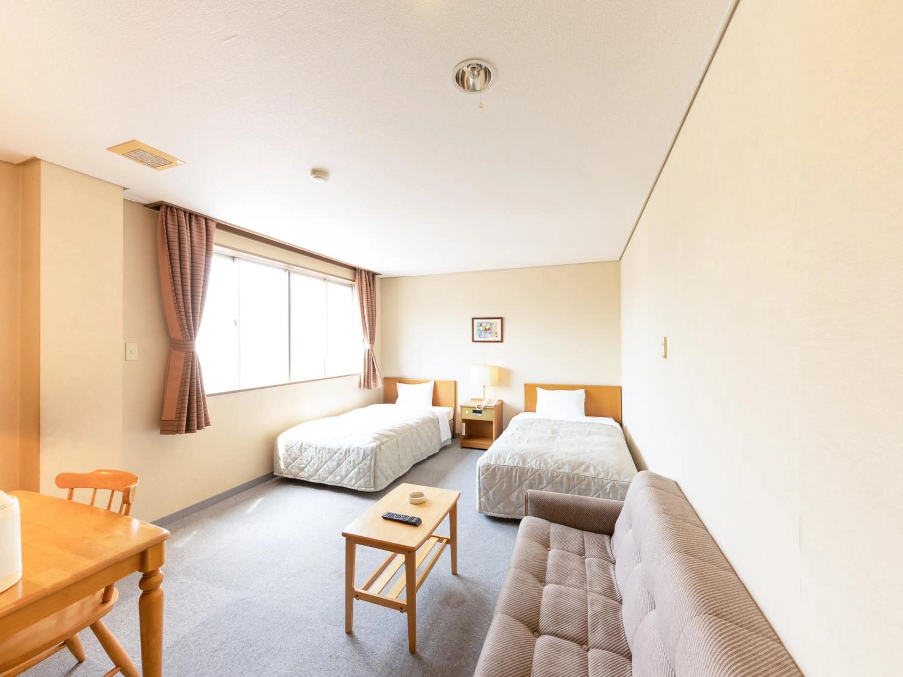 Bed in Tabist Kanko Business Hotel Matsuyama Hida Takayama