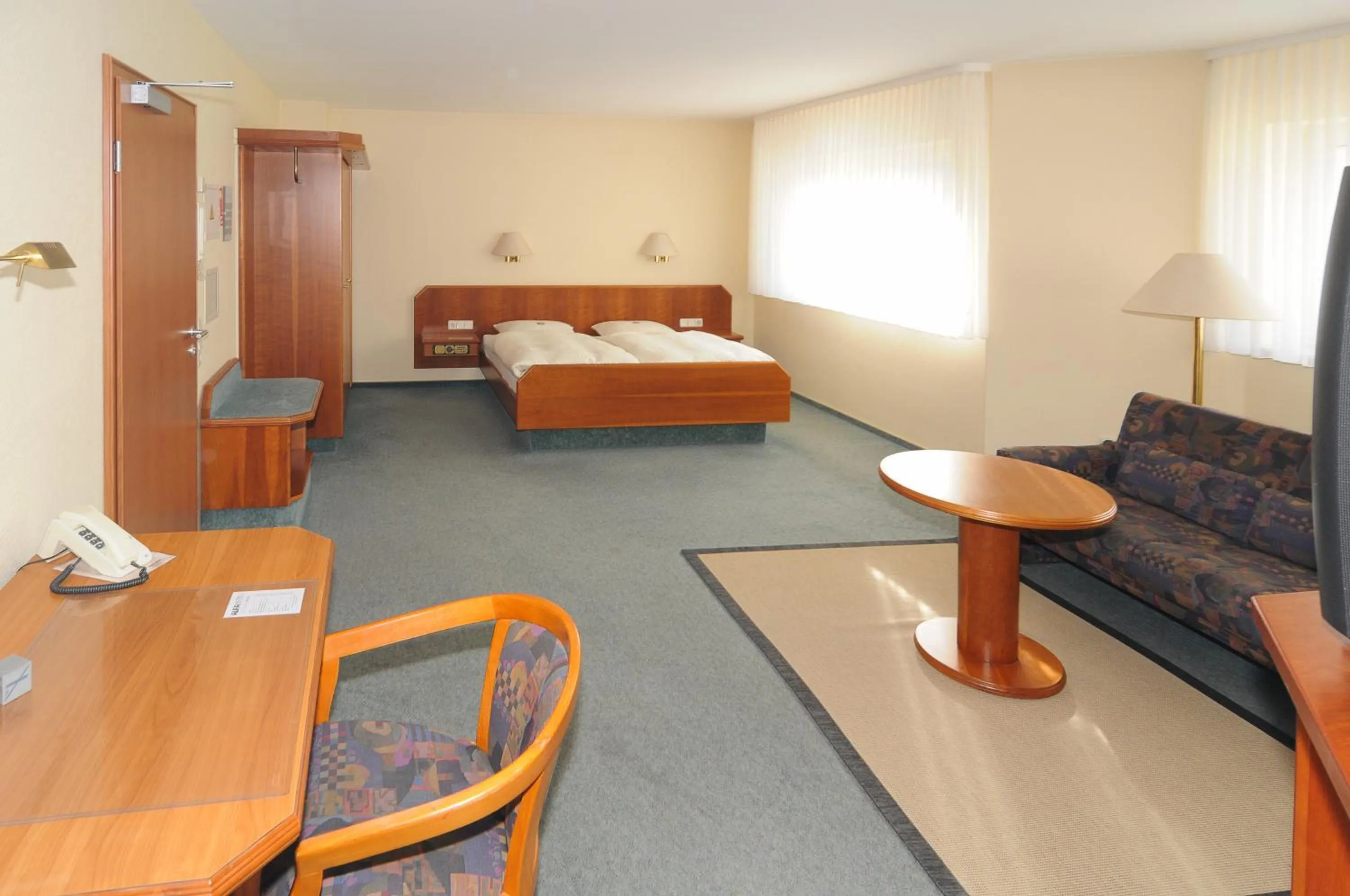 Seating area, Bed in Alfa Apartment Hotel