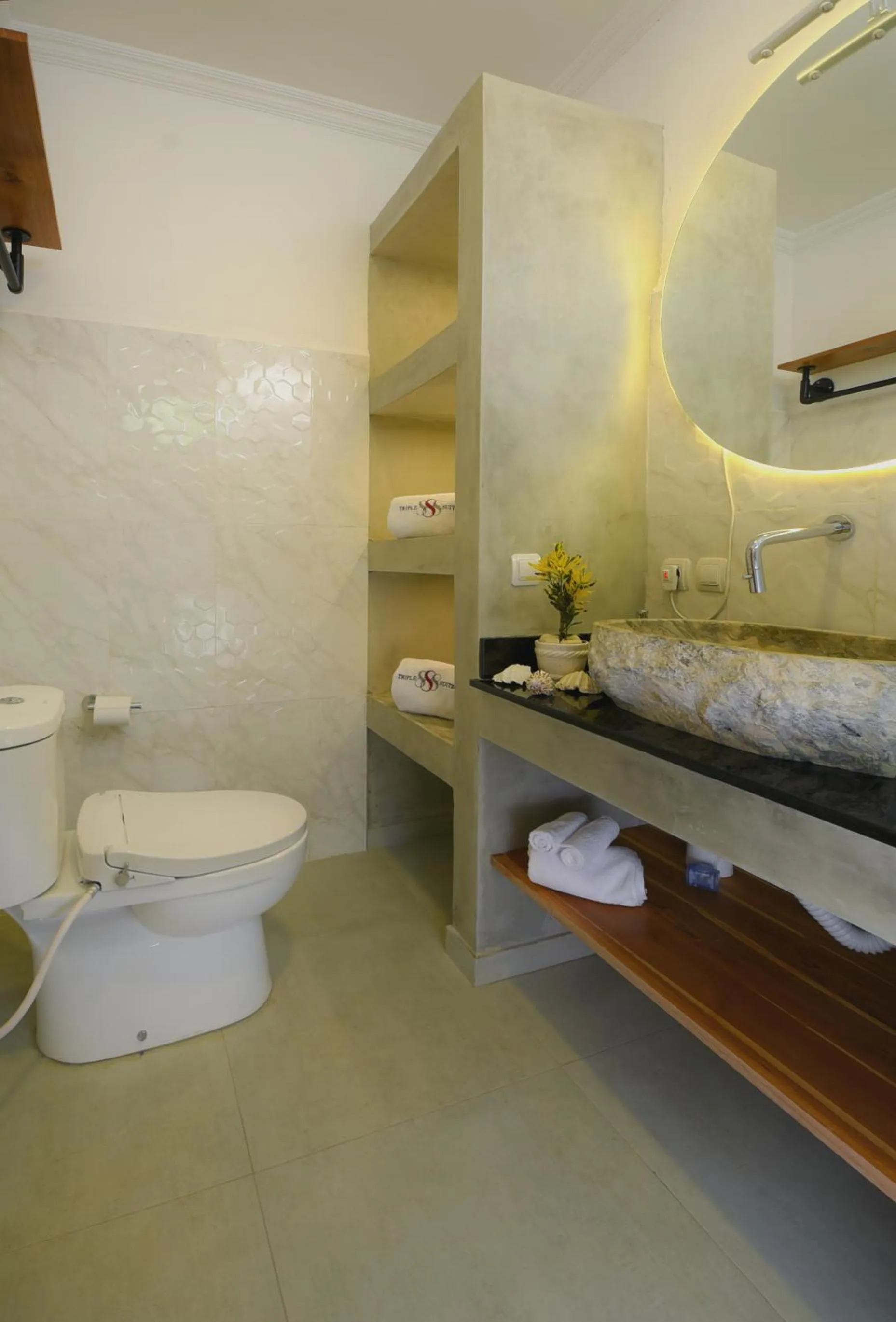 Toilet in Triple 8 Suites