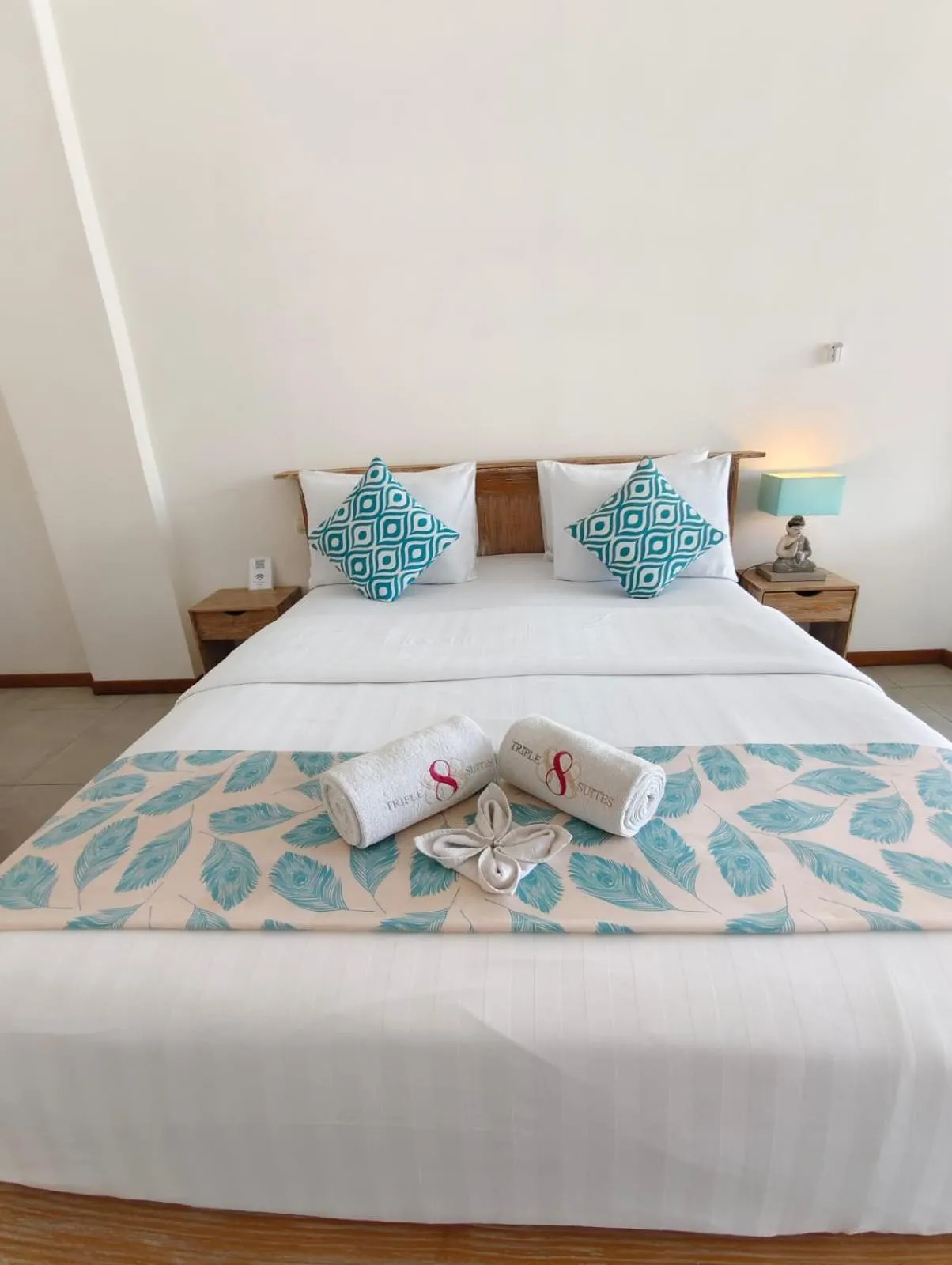 Bed in Triple 8 Suites