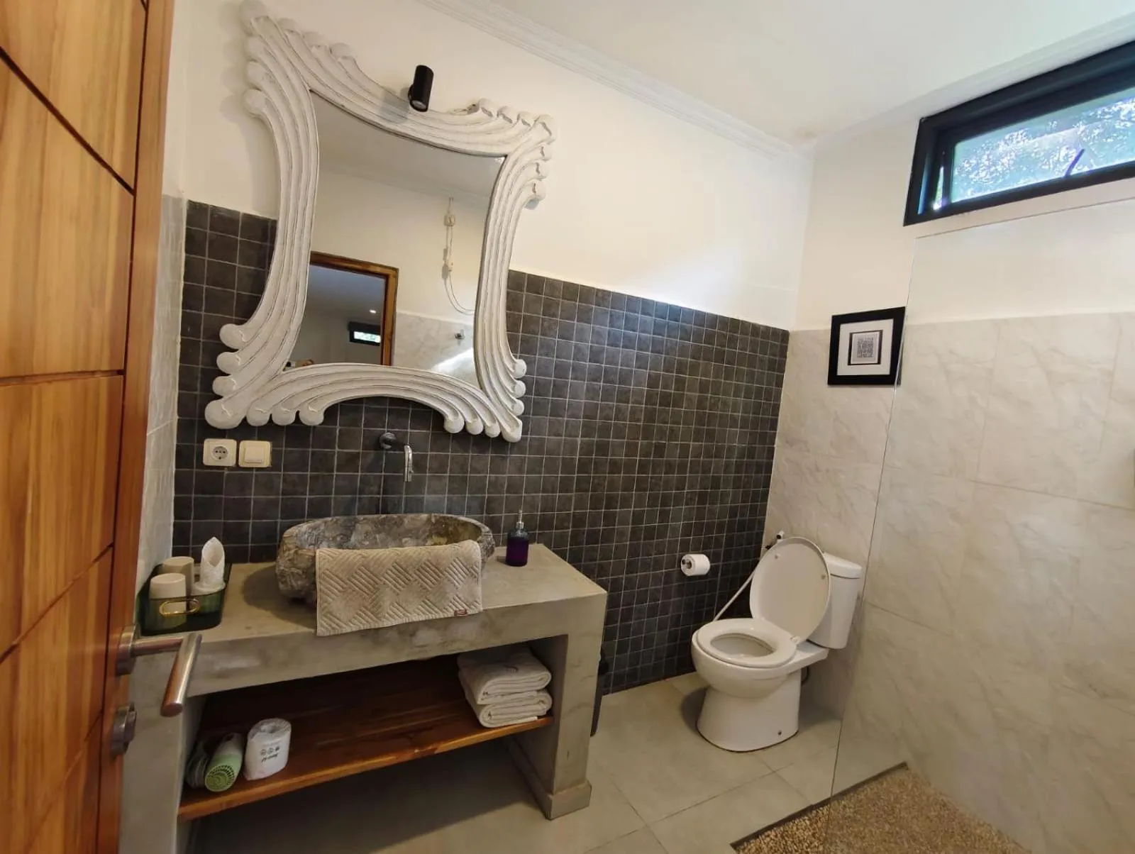 Toilet in Triple 8 Suites