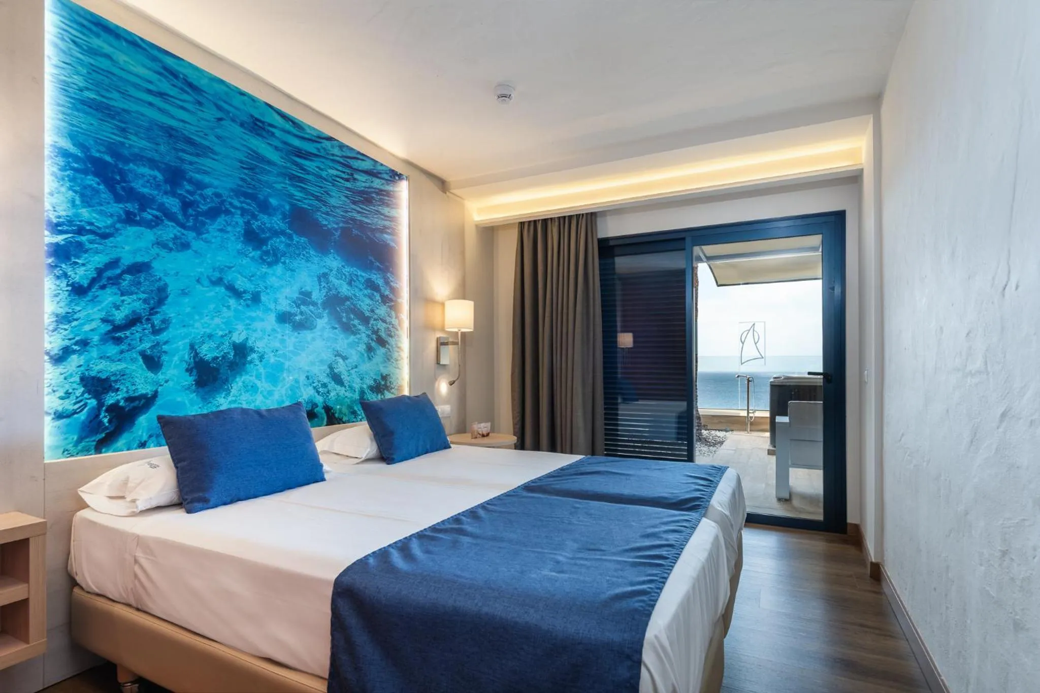 Bedroom, Bed in Apartamentos Garden & Sea Boutique Lodging by LIVVO