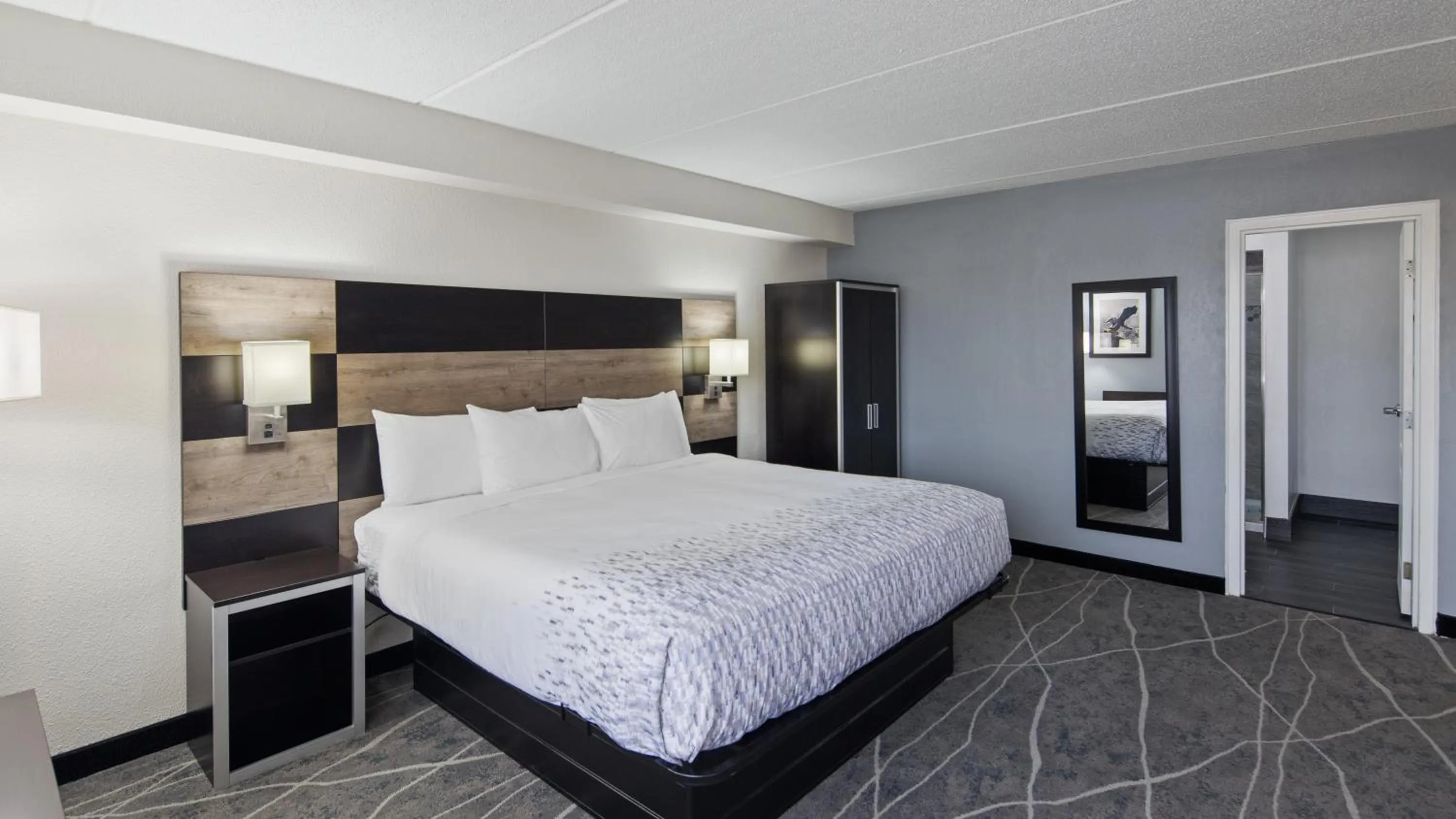 Bedroom, Bed in Clarion Pointe Jacksonville near Camp Lejeune