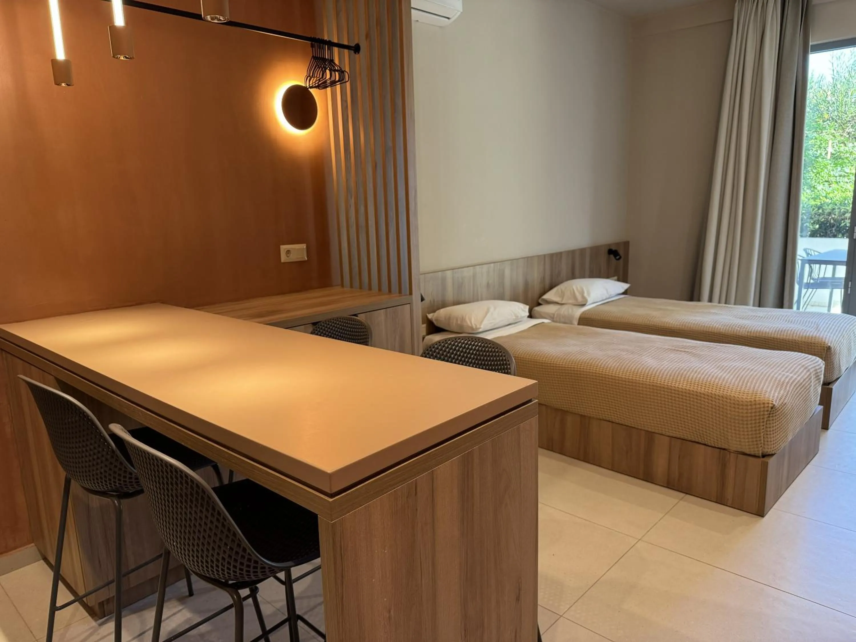 Bed in Philoxenia Apartments