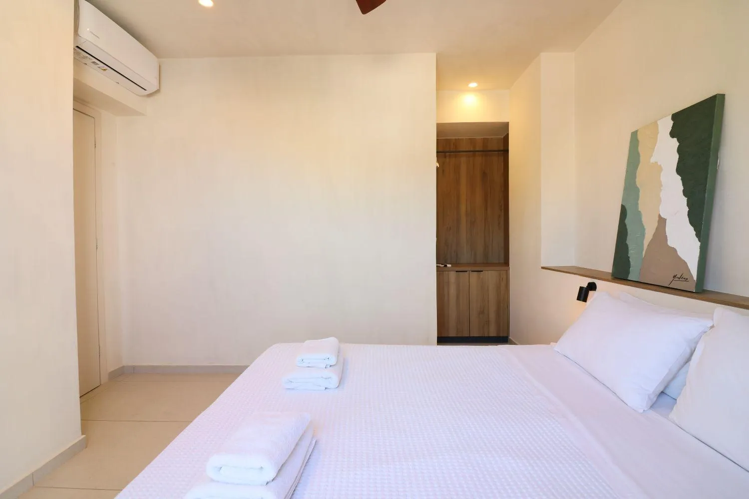 Bed in Philoxenia Apartments