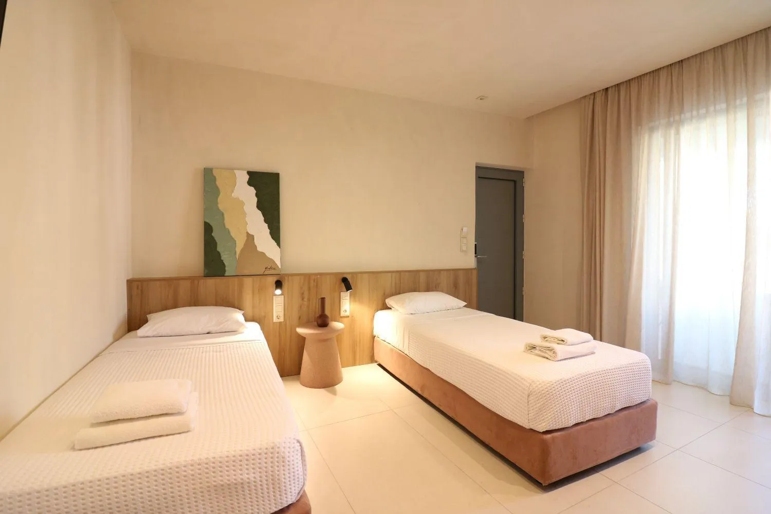 Bed in Philoxenia Apartments