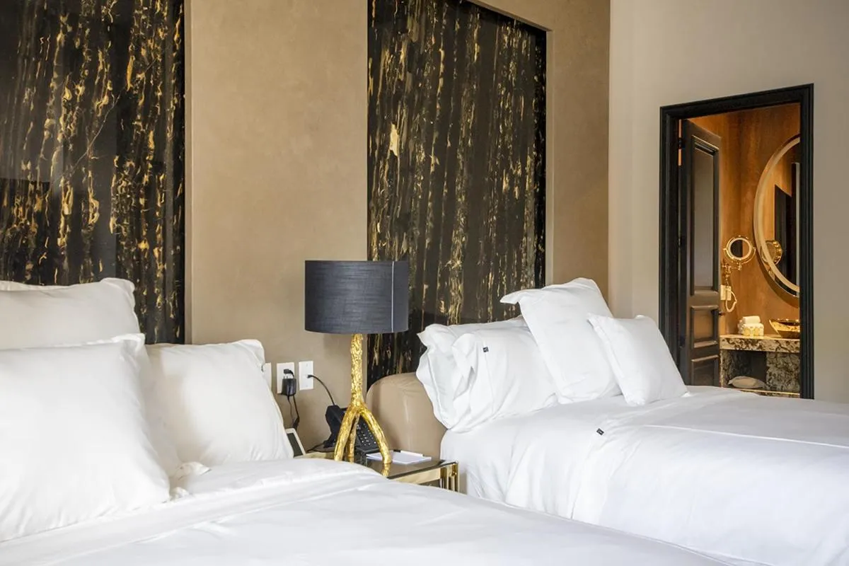 Bed in L Hotel Perla Boutique