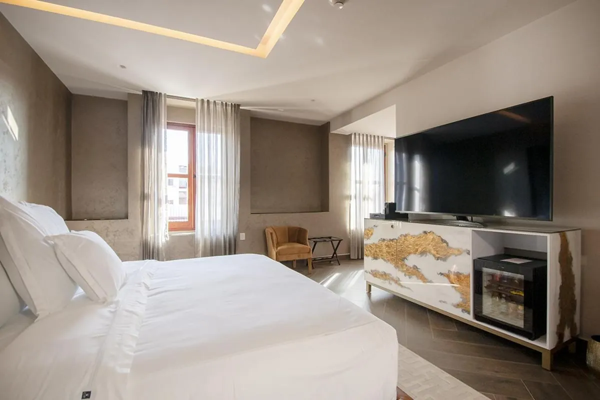 Bed in L Hotel Perla Boutique