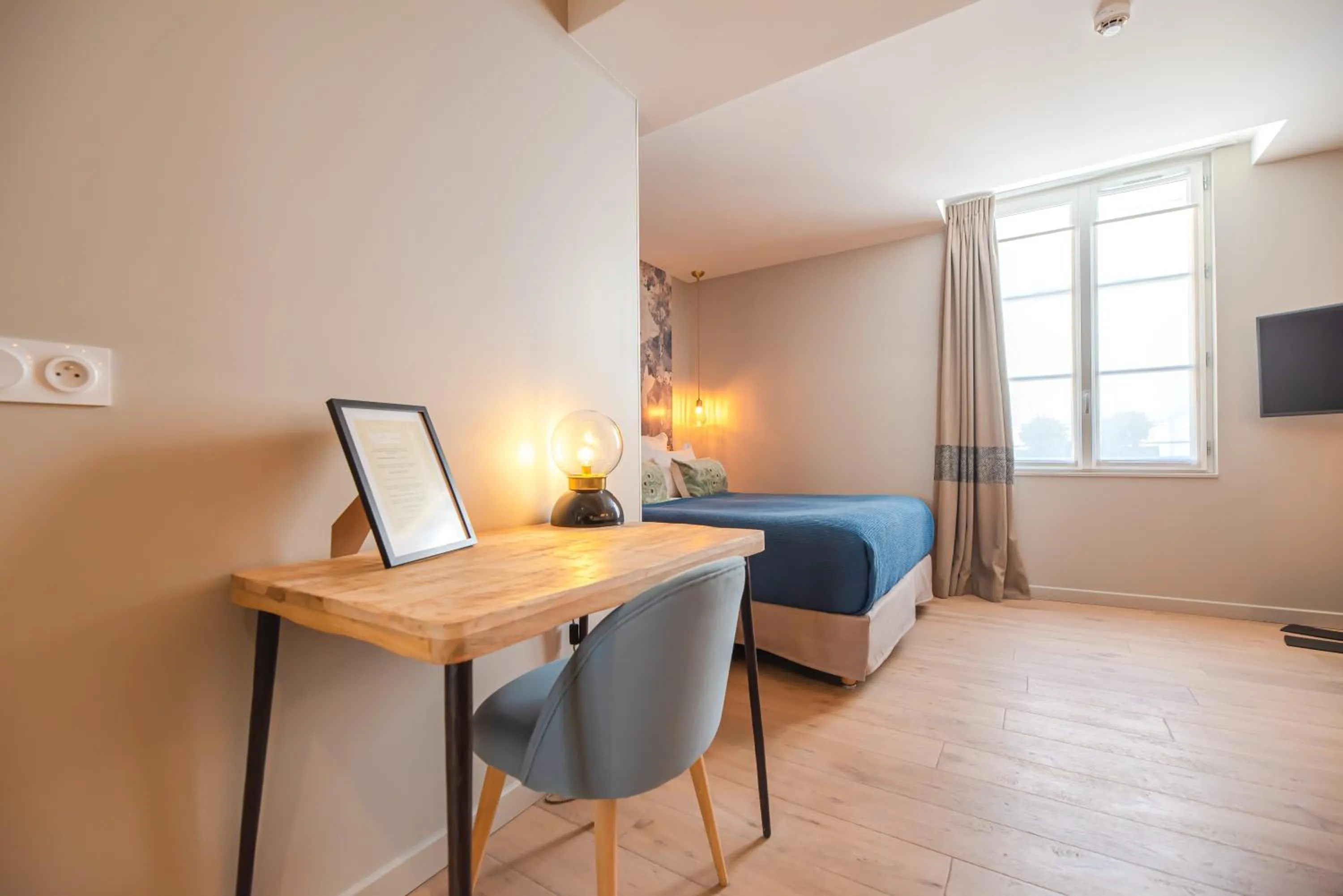 Seating area, Bed in Residence Les Boulevards