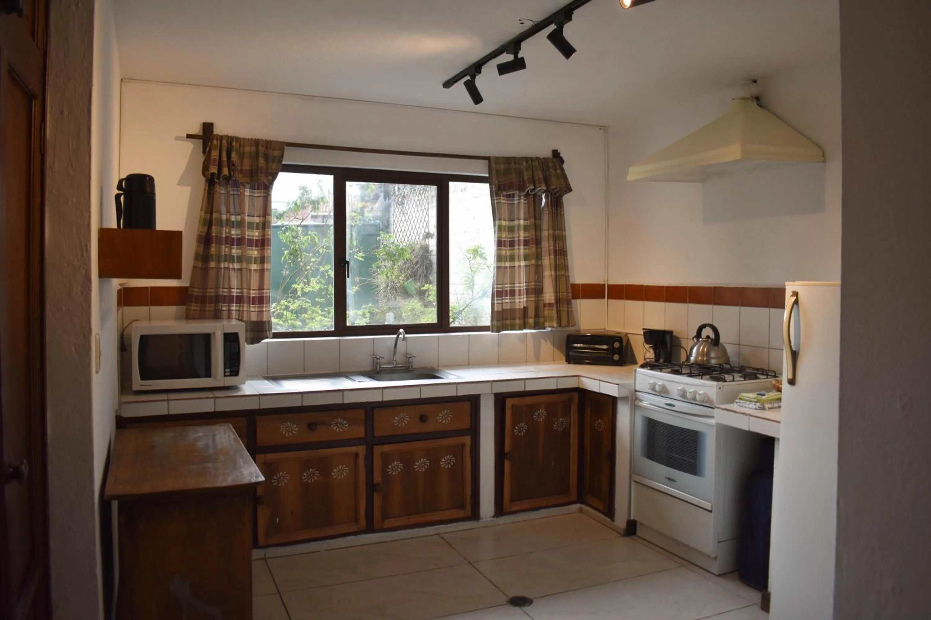 Kitchen or kitchenette in Apartamentos Otorongo Cuenca Ecuador