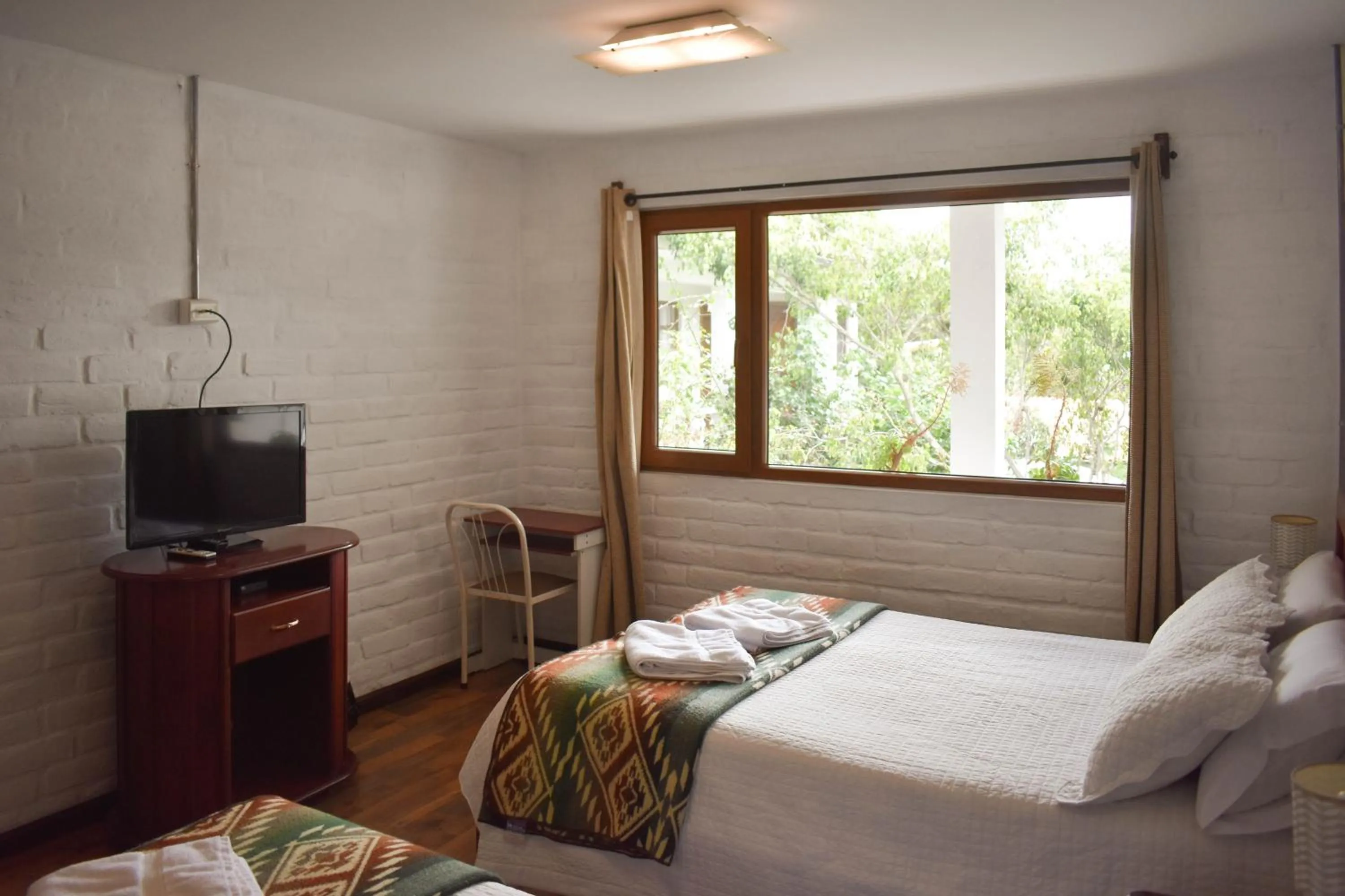 TV and multimedia, Bed in Apartamentos Otorongo Cuenca Ecuador