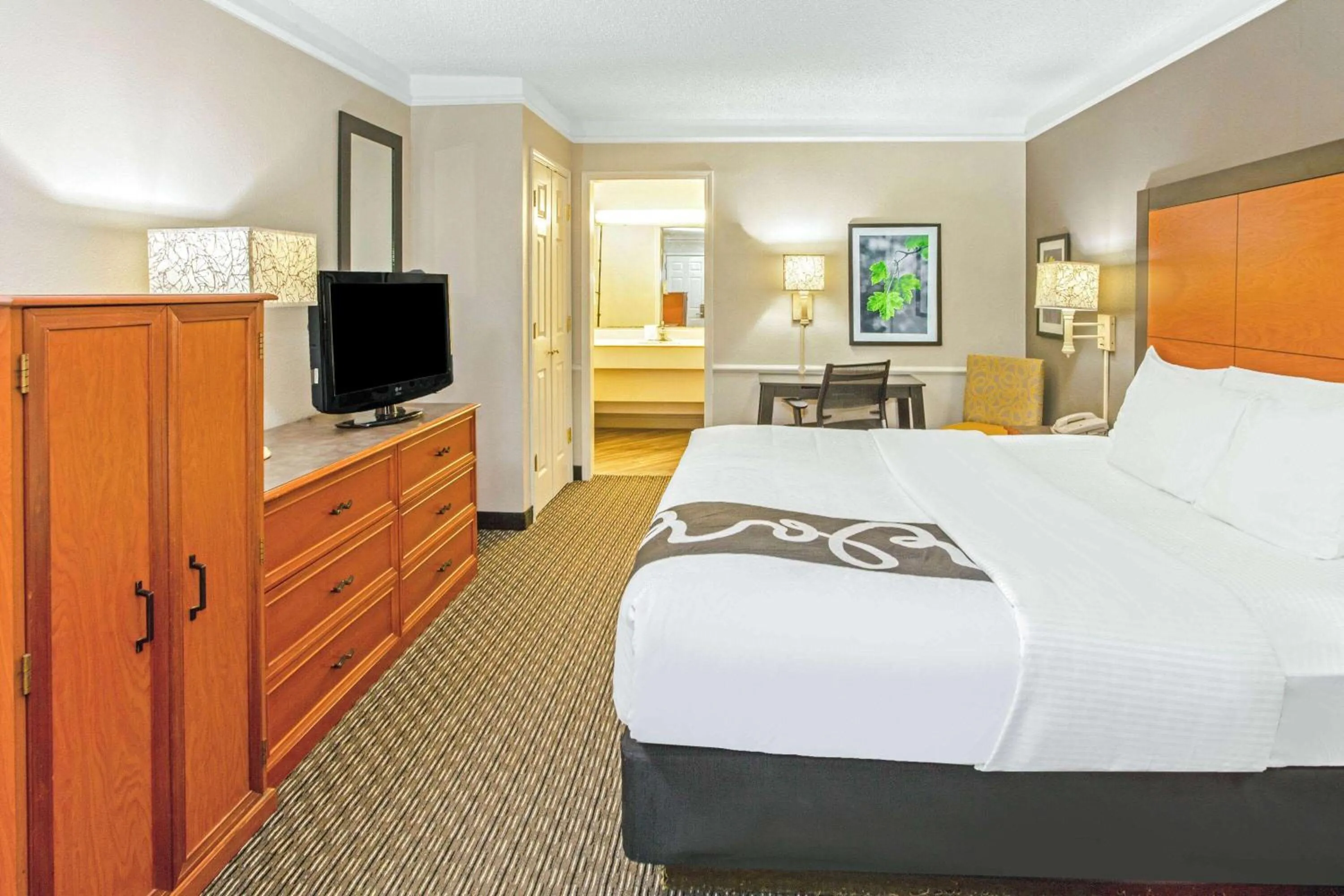 Photo of the whole room, TV/Entertainment Center in La Quinta Inn by Wyndham Wichita Falls Event Center North