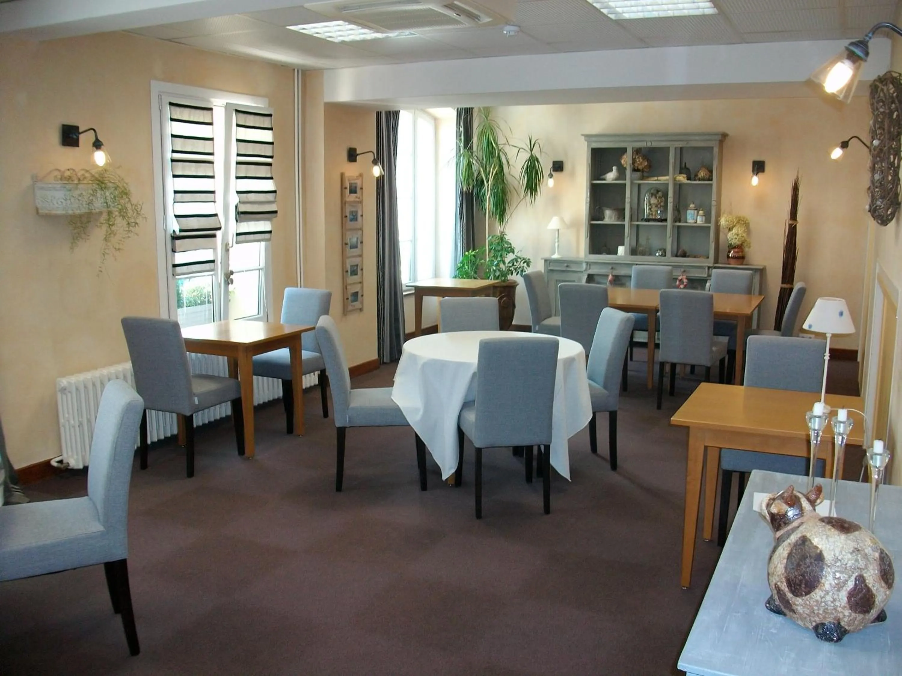 Seating area in Logis Hôtel Le Central