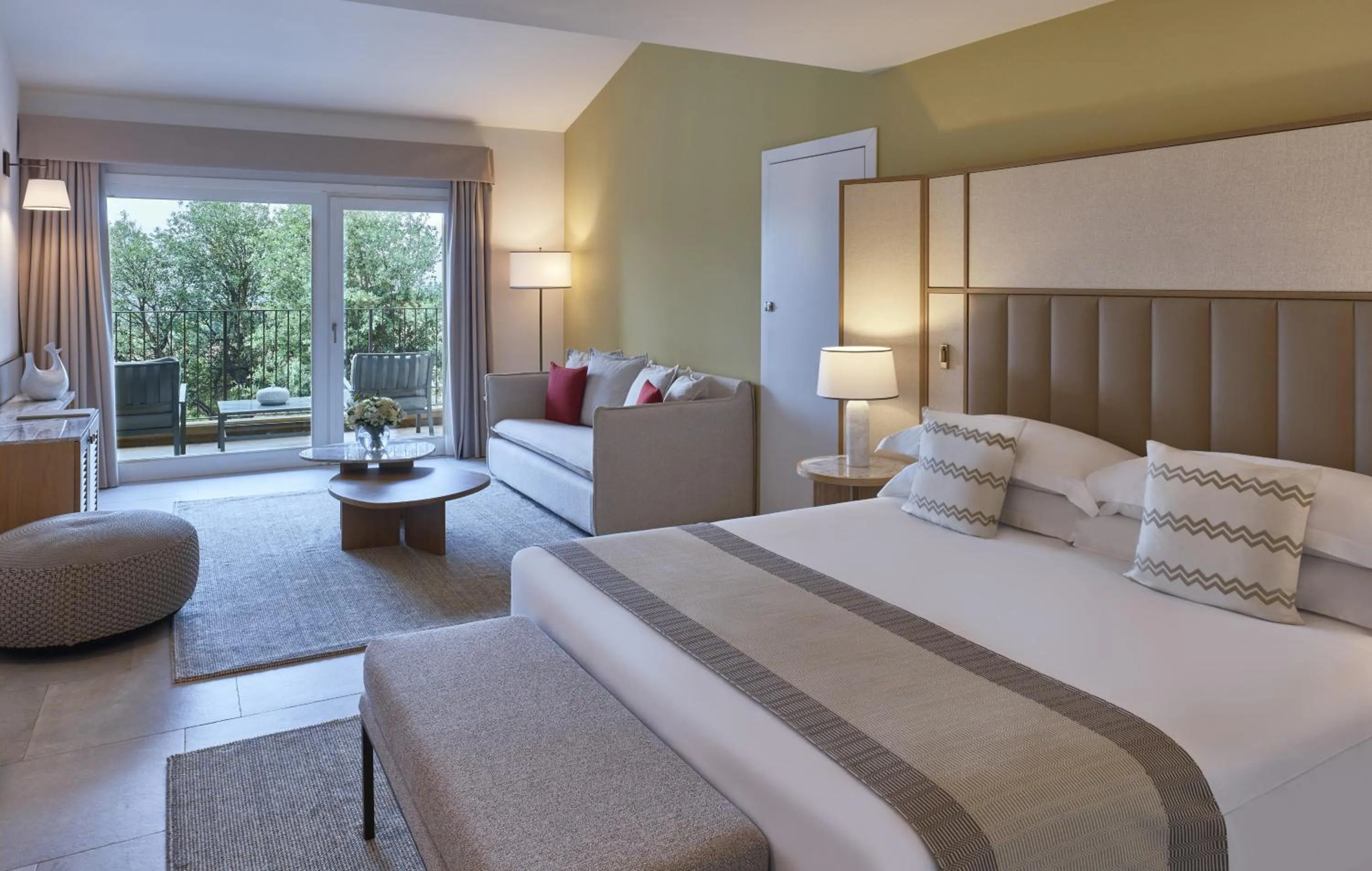 Seating area, Bed in Conrad Chia Laguna Sardinia