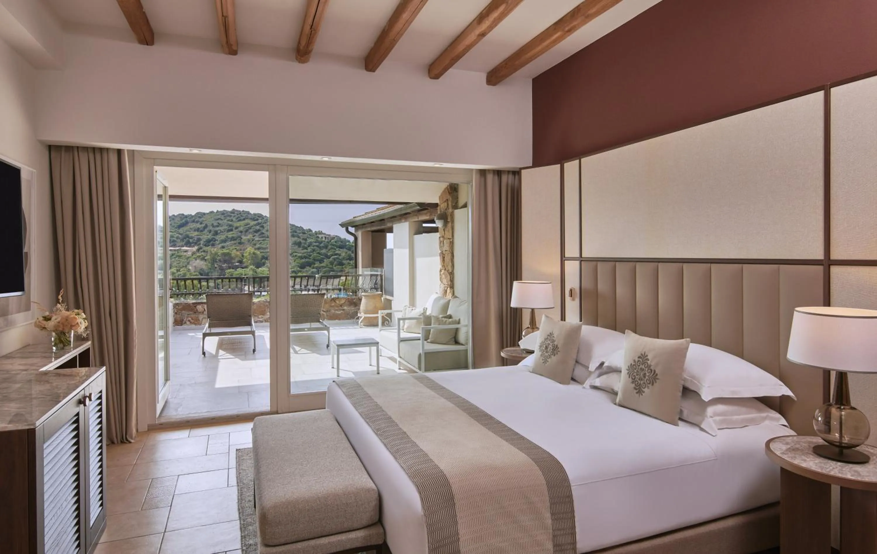 Photo of the whole room, Bed in Conrad Chia Laguna Sardinia