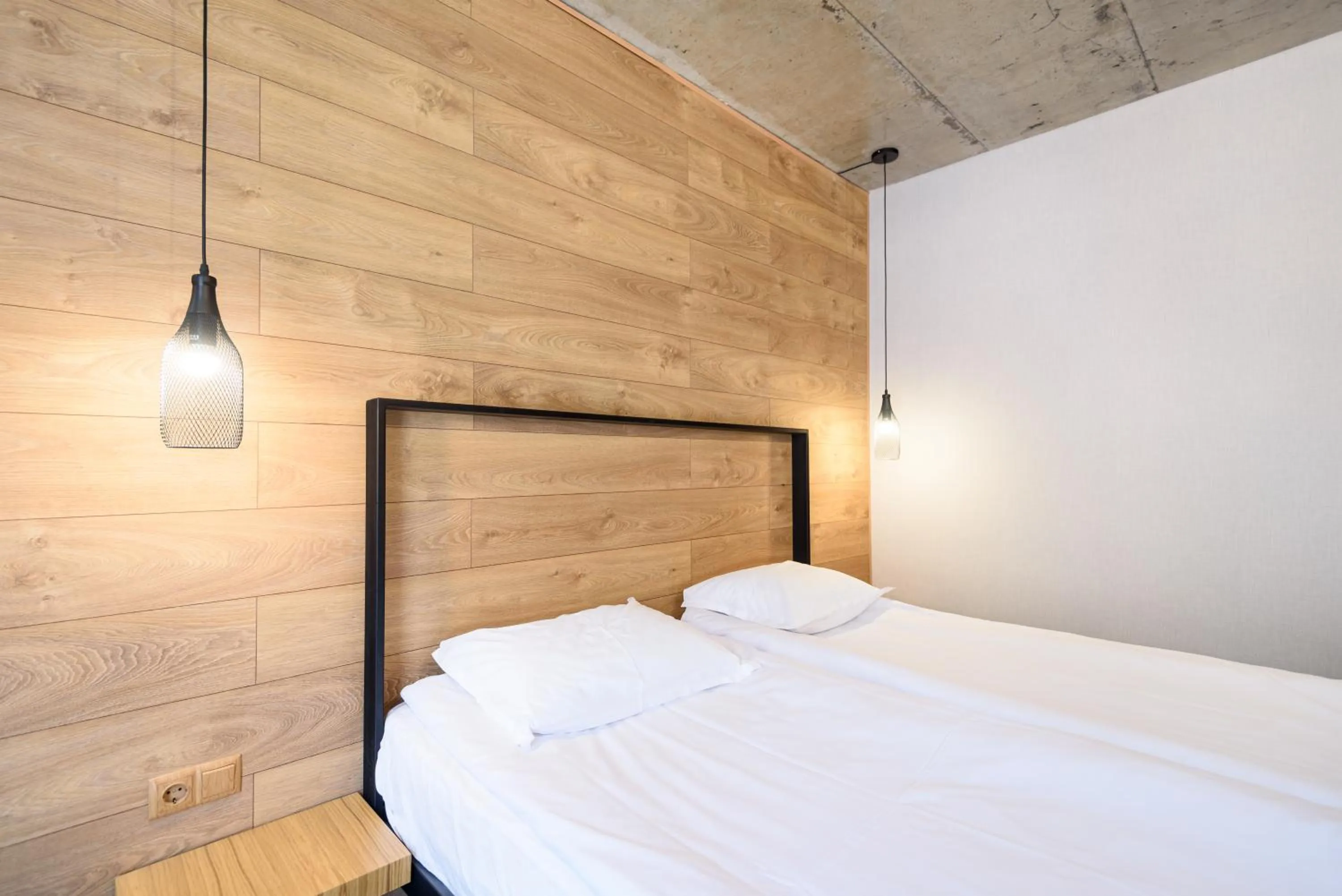 Bed in Avenue Hotel Deluxe