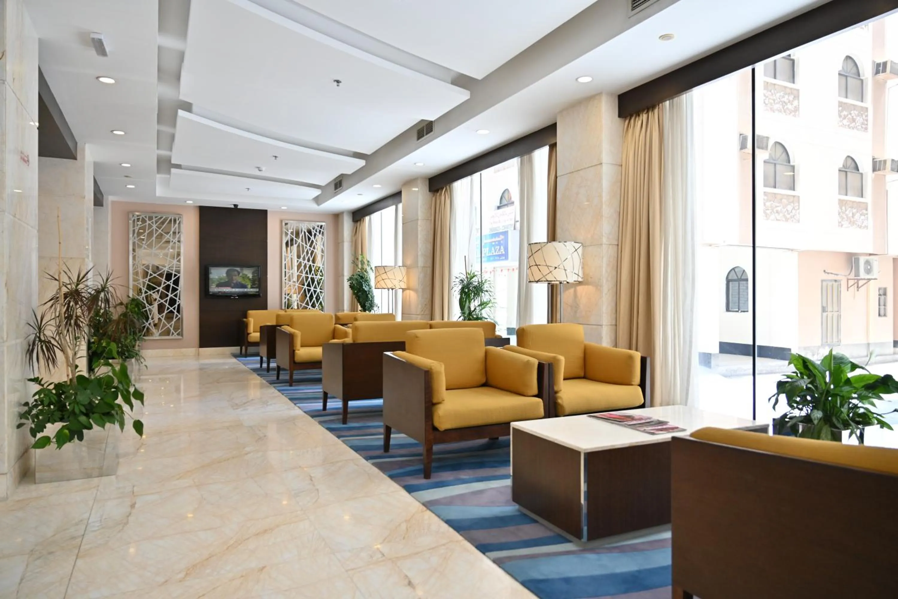 Lobby or reception in Harbour Suites Hotel