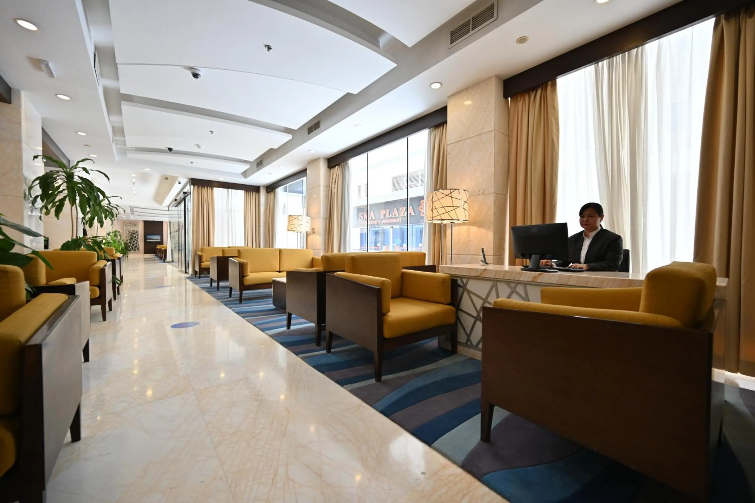 Lobby or reception in Harbour Suites Hotel