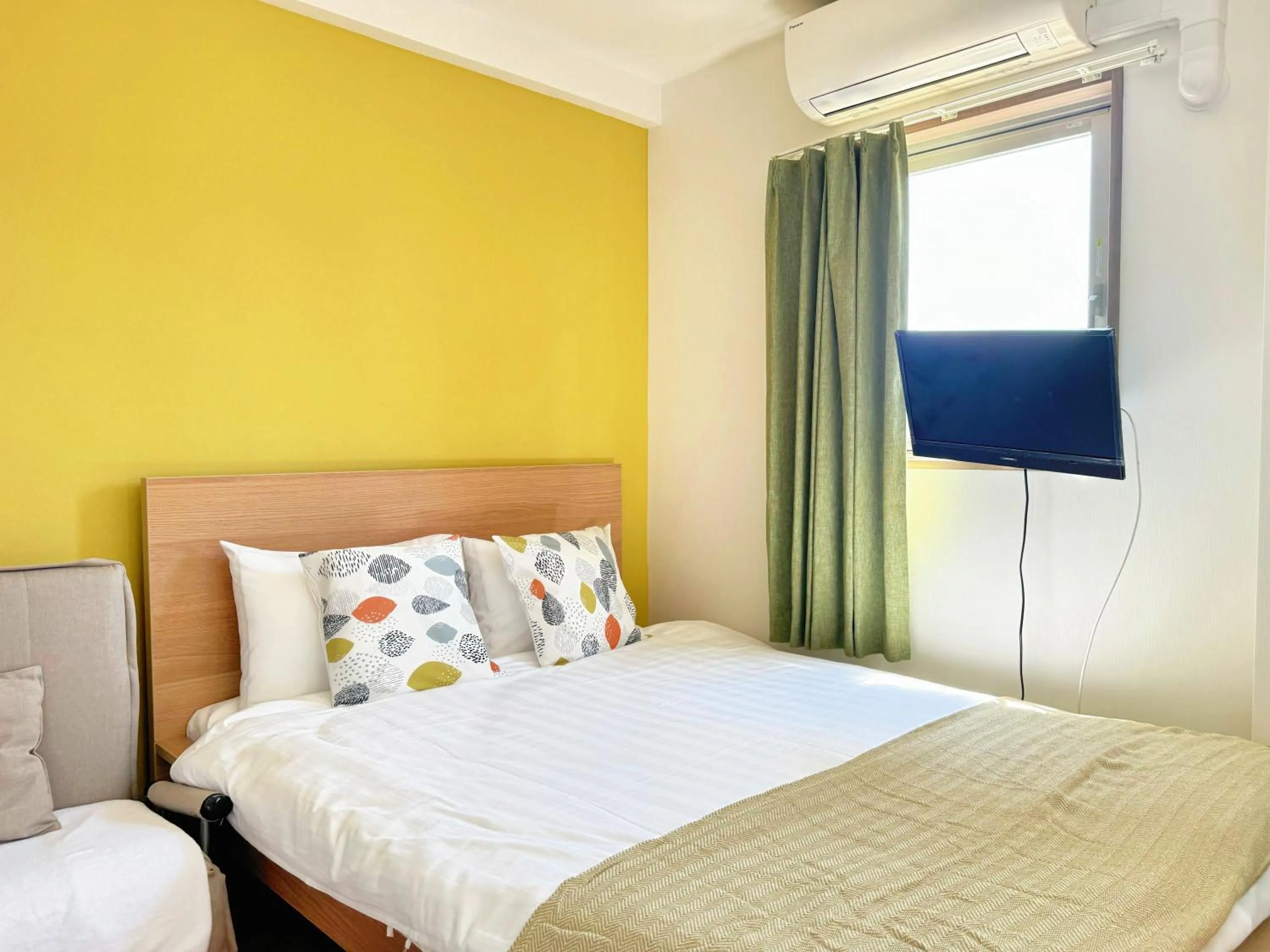 Bed in Juso AFP Apartment Hotel