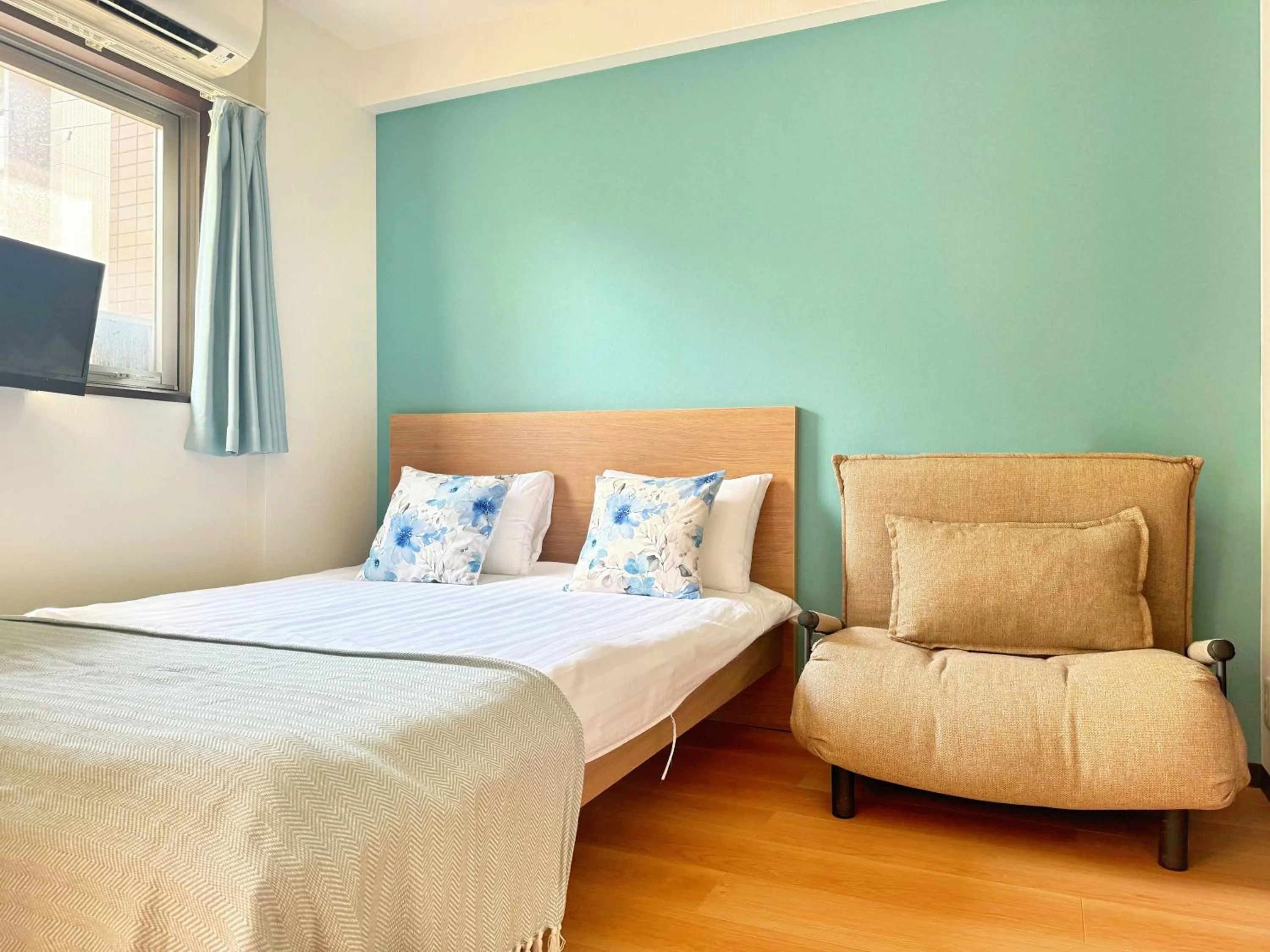 Bed in Juso AFP Apartment Hotel