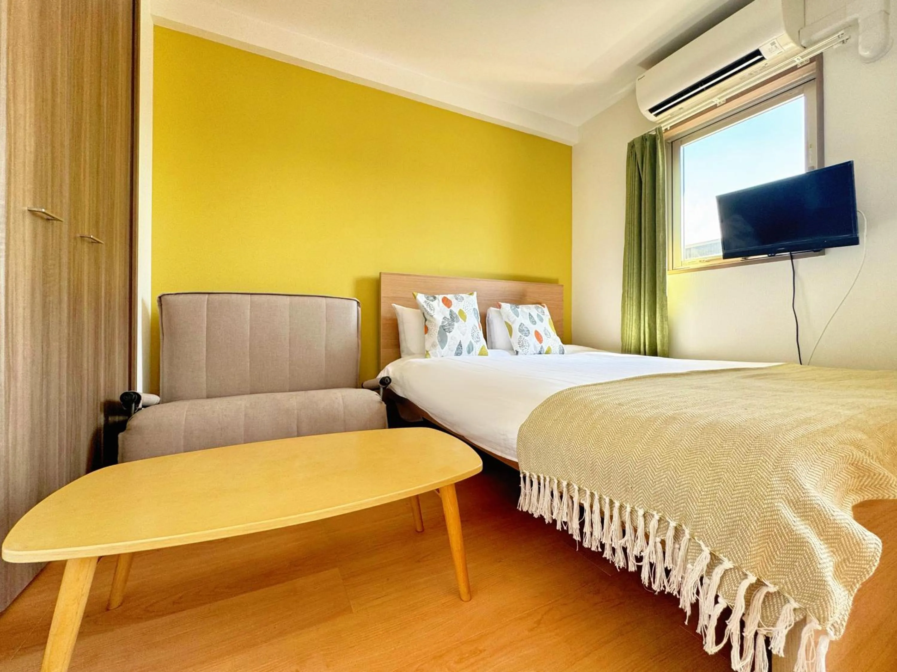 Bed in Juso AFP Apartment Hotel