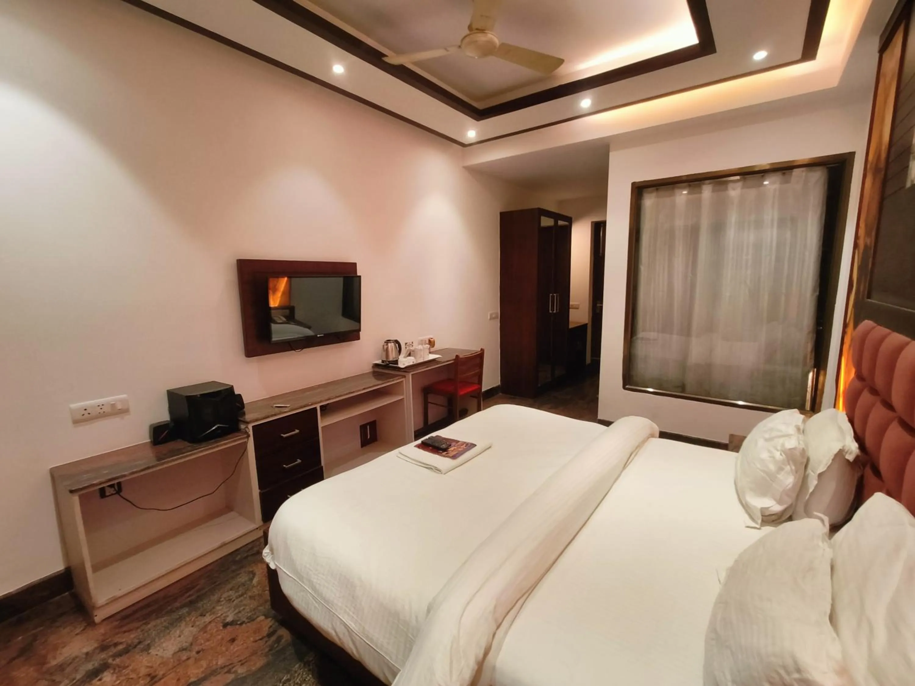 Bed in JJK Rukmini Vilas Hotel & Banquet