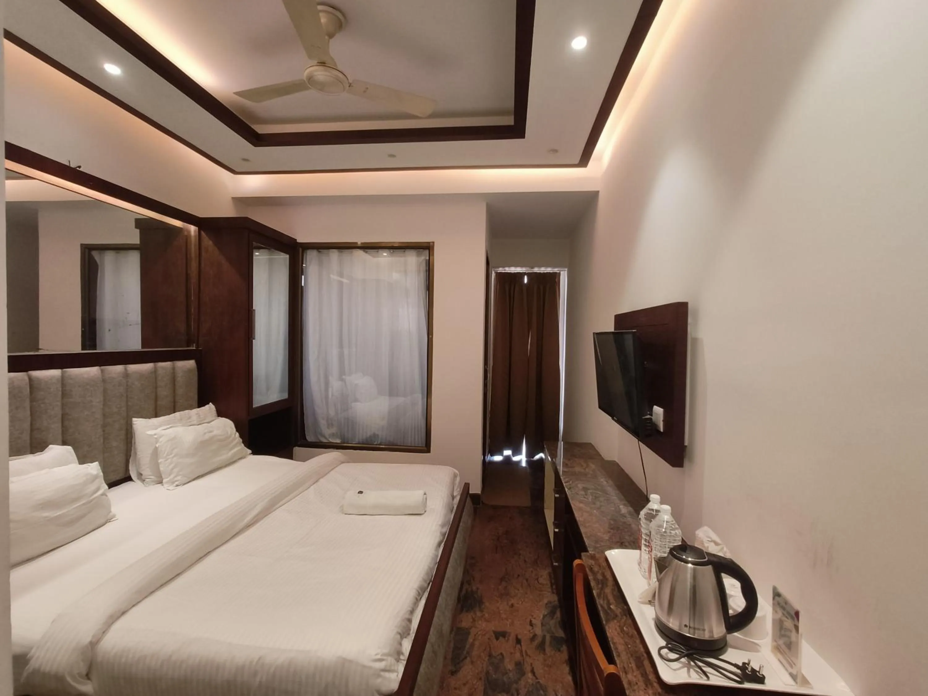 Bed in JJK Rukmini Vilas Hotel & Banquet