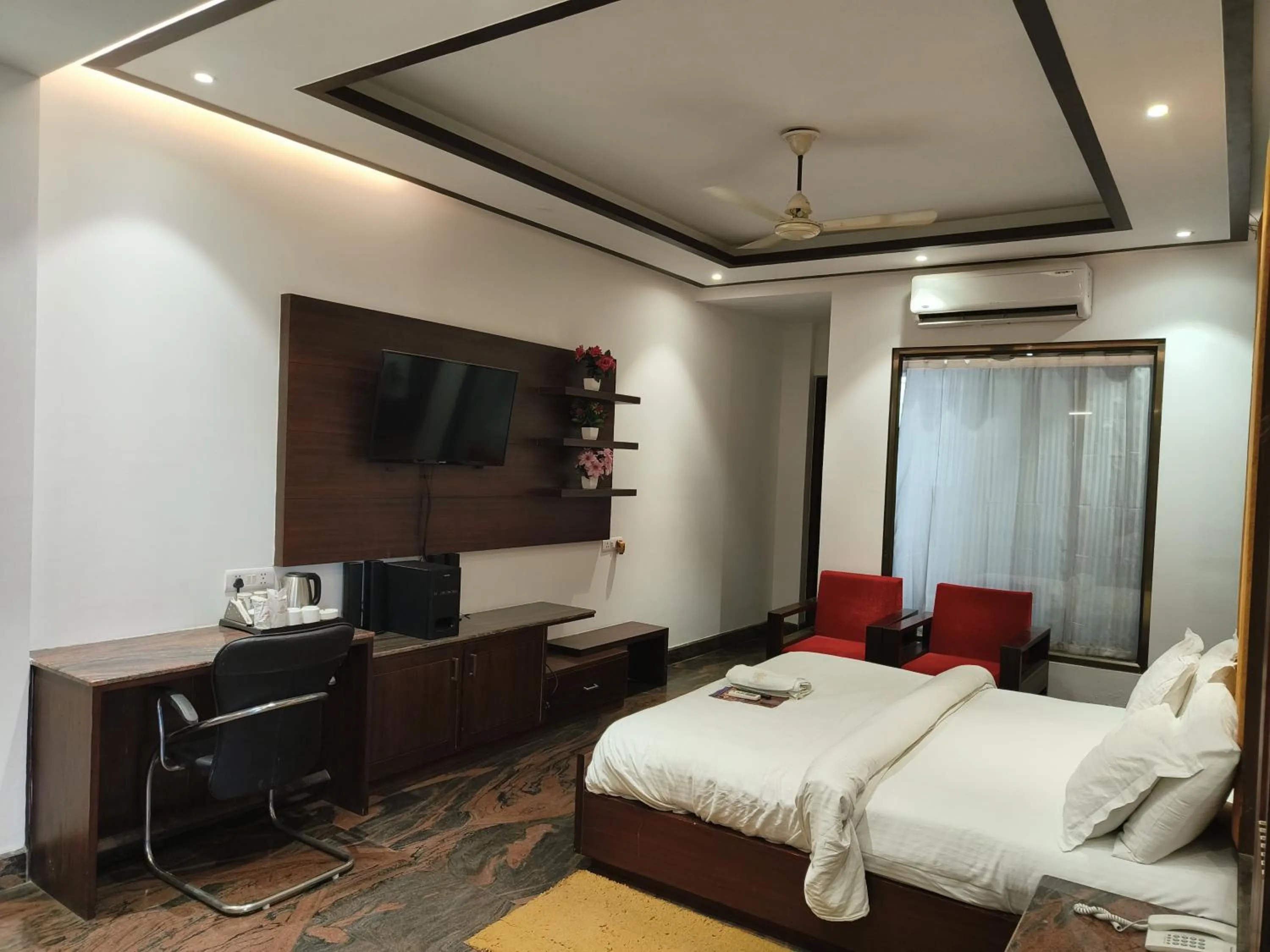 Bed in JJK Rukmini Vilas Hotel & Banquet