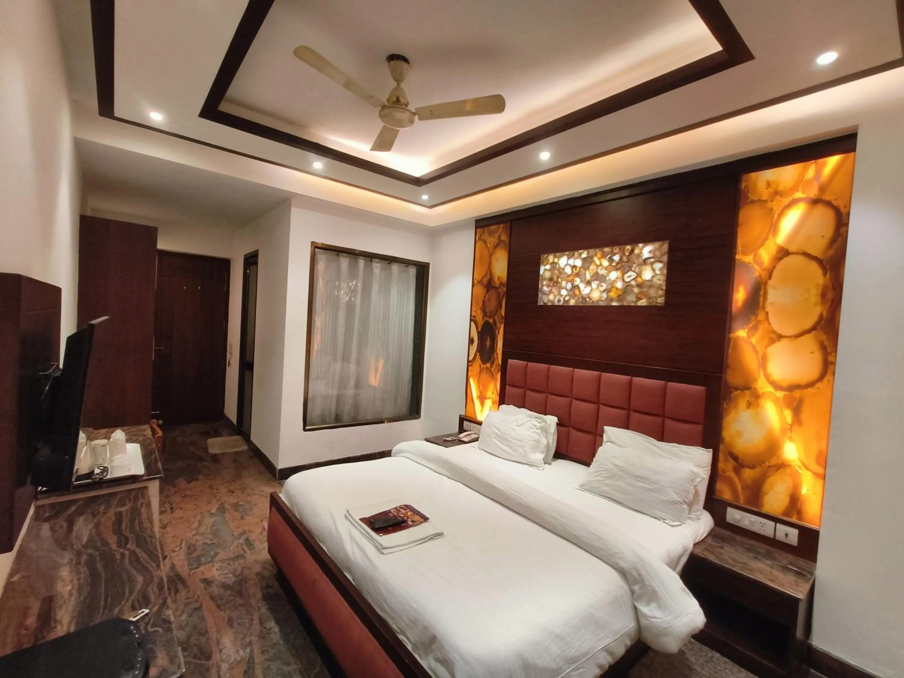 Bed in JJK Rukmini Vilas Hotel & Banquet