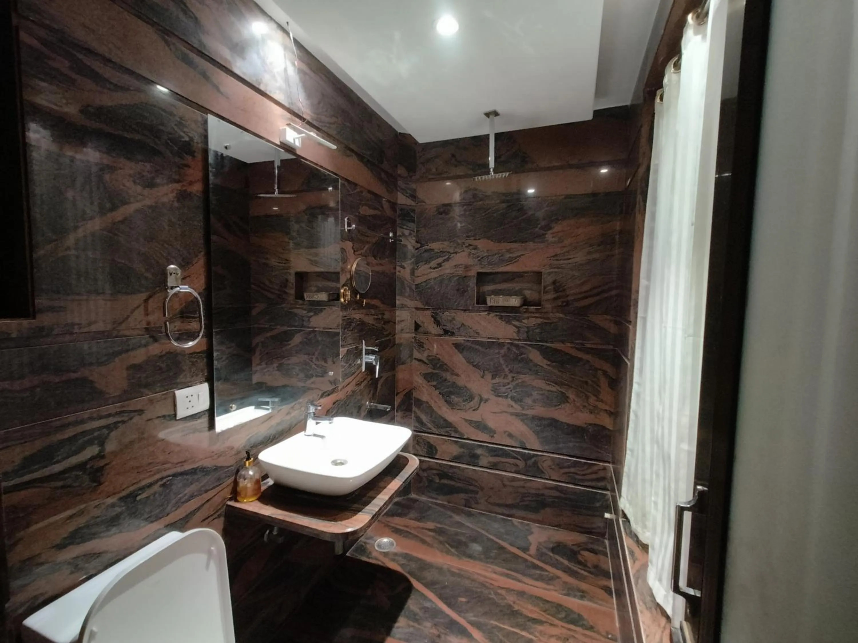 Bathroom in JJK Rukmini Vilas Hotel & Banquet