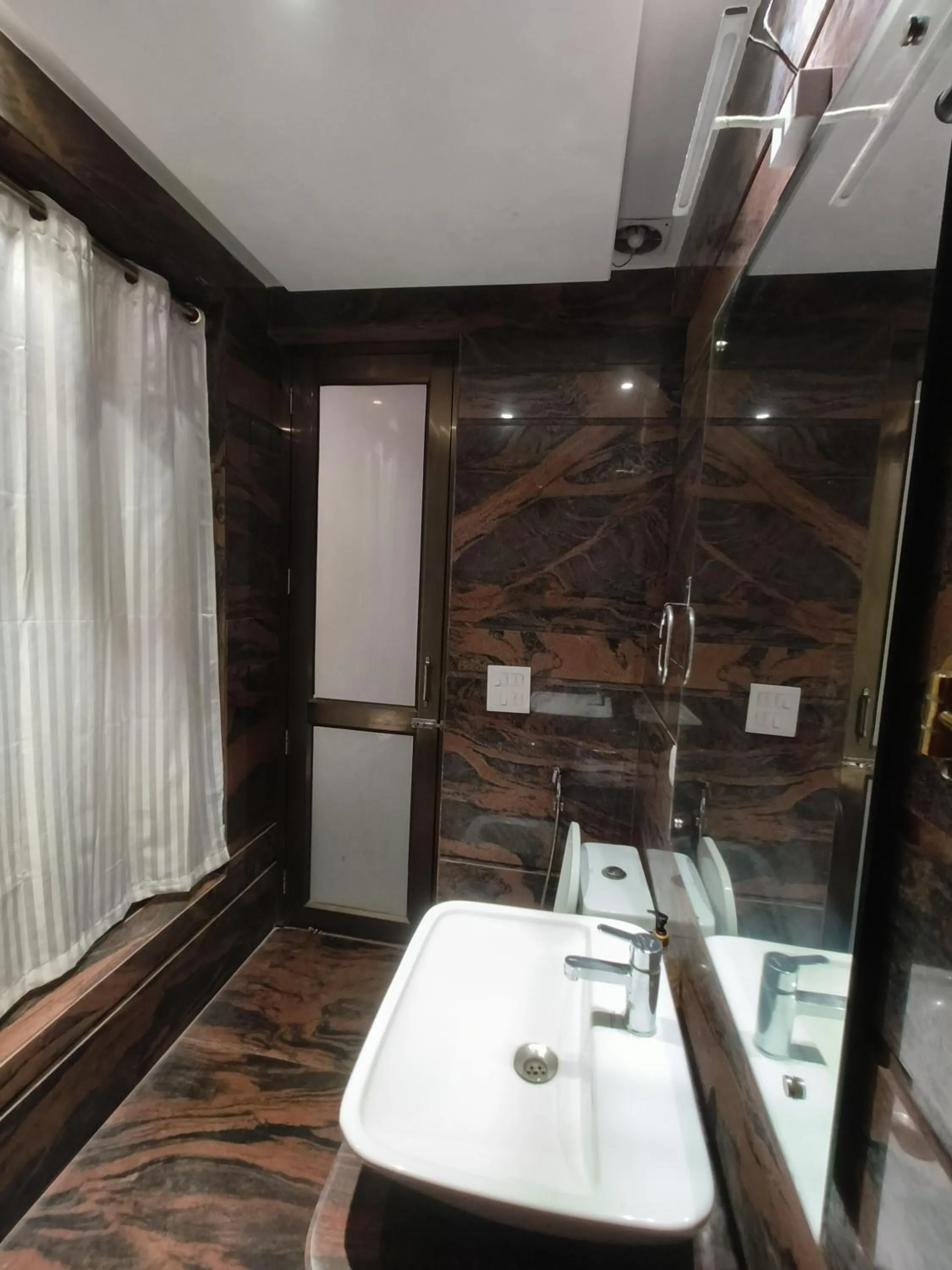 Shower in JJK Rukmini Vilas Hotel & Banquet