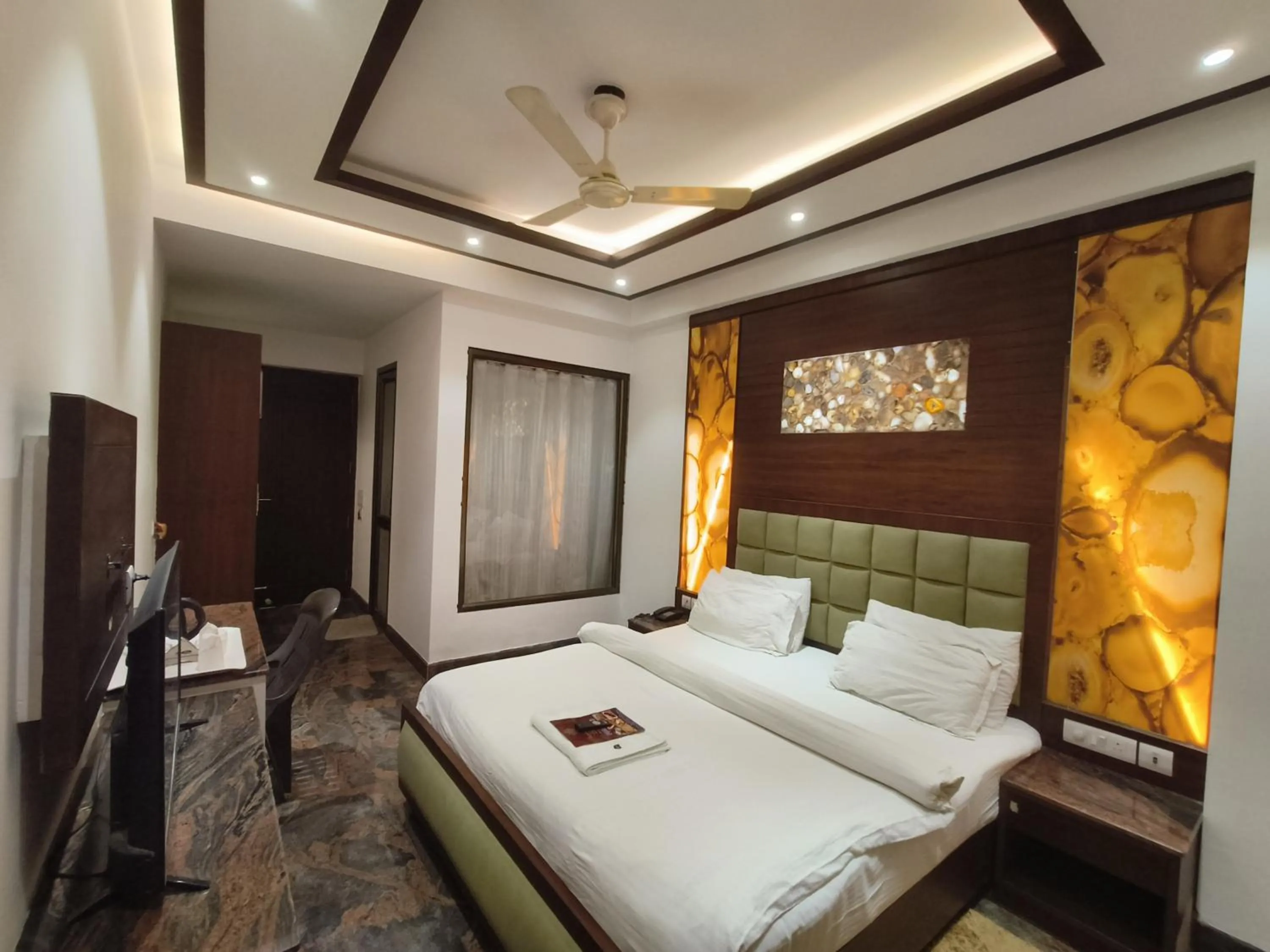 Bed in JJK Rukmini Vilas Hotel & Banquet