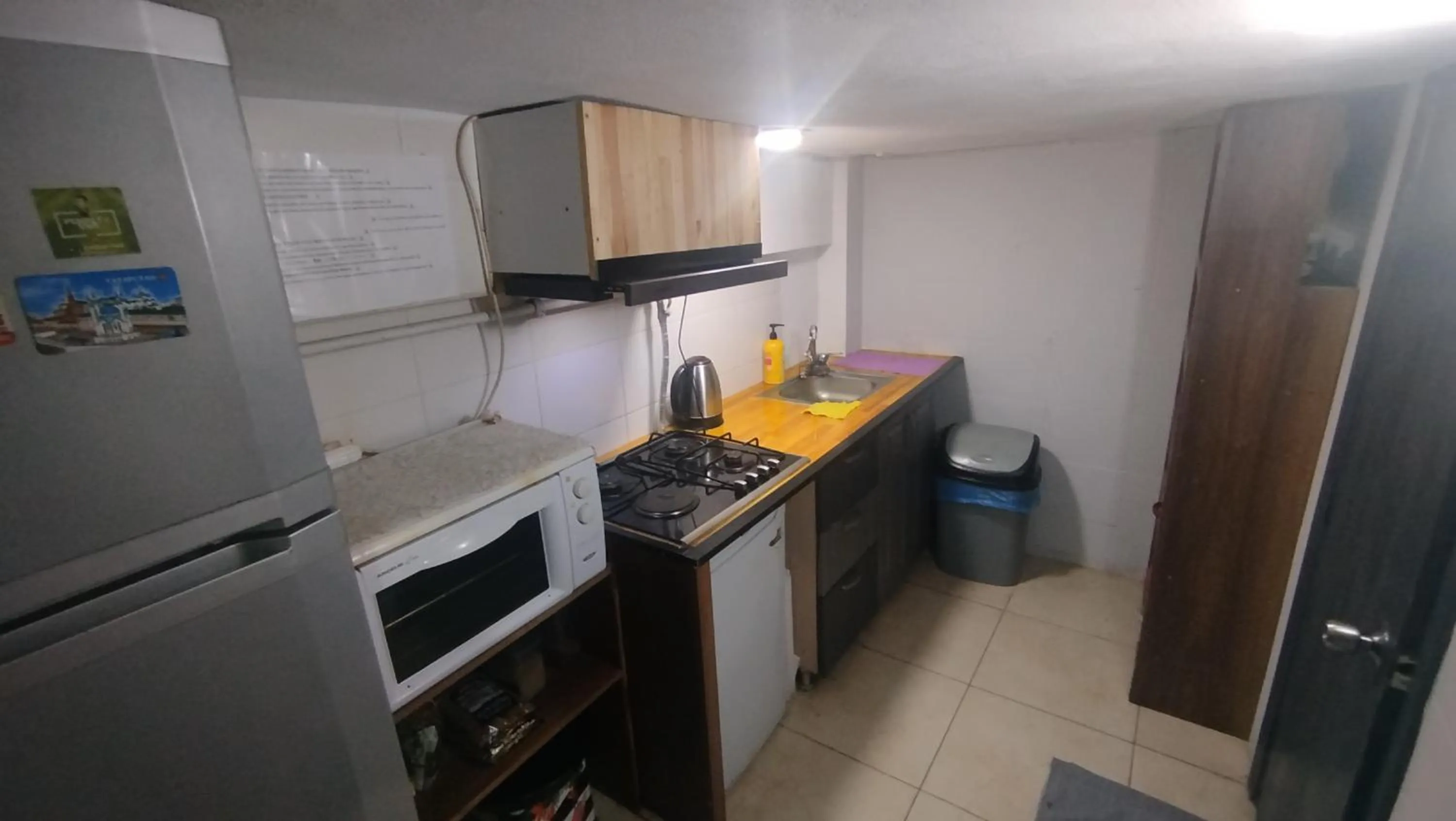 Communal kitchen in ivy hostel cafe