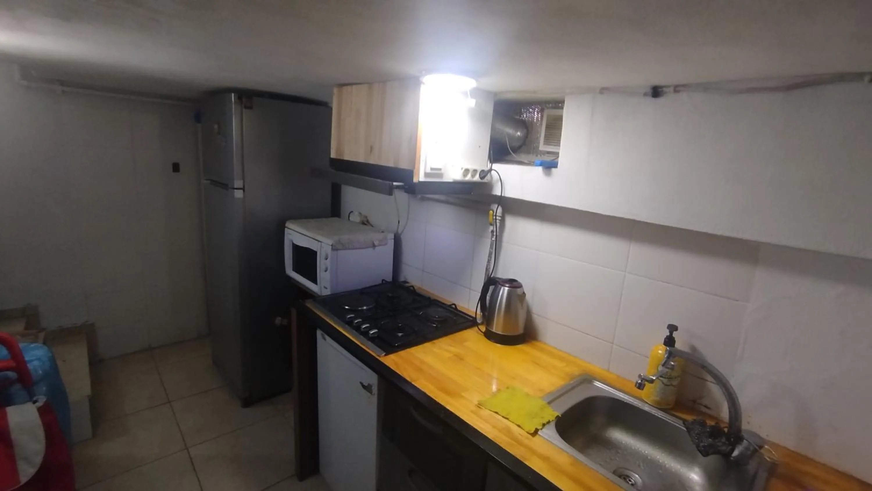 Communal kitchen in ivy hostel cafe