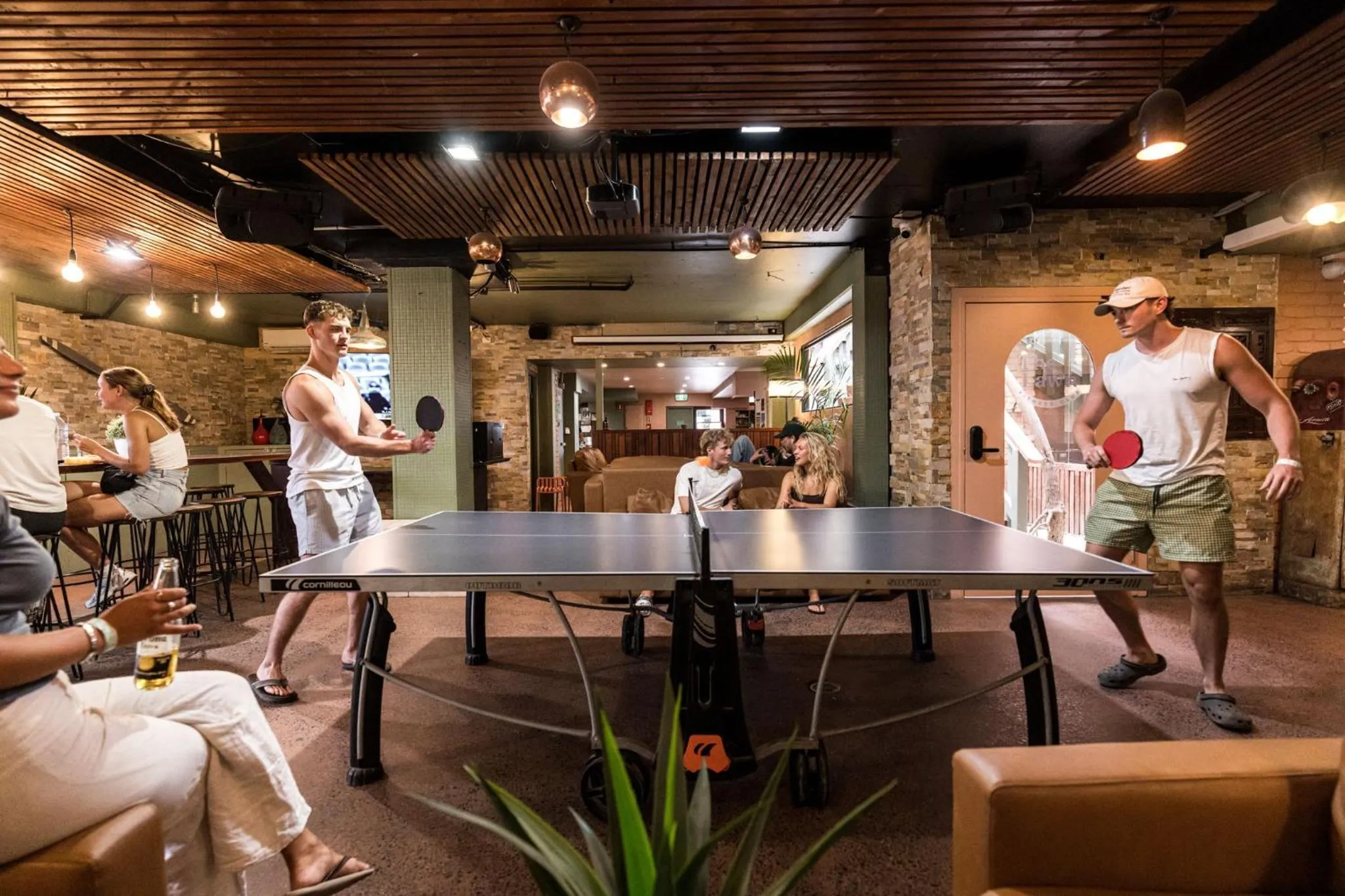 Communal lounge/ TV room in Aquarius Backpackers Resort