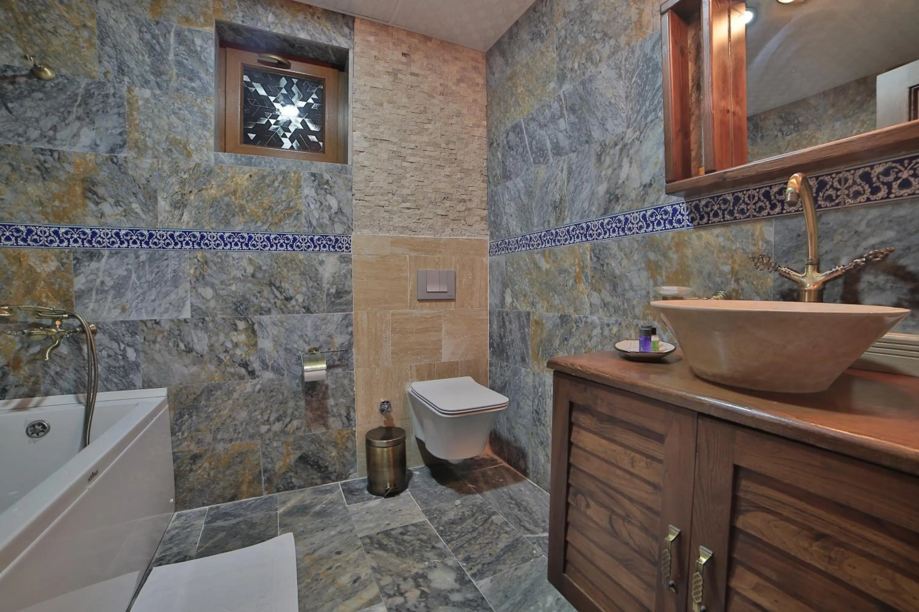 Toilet in Caravanserai Inn Hotel