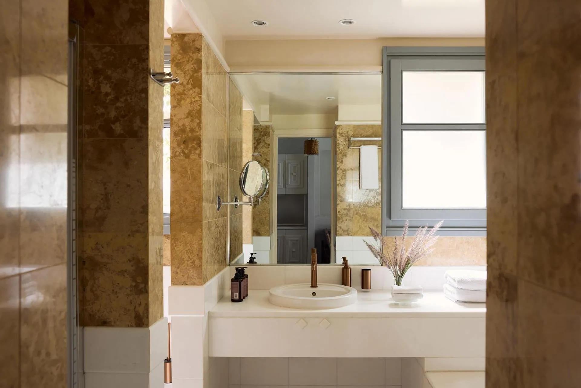 Bathroom in Porto Kea Suites by Sandglass