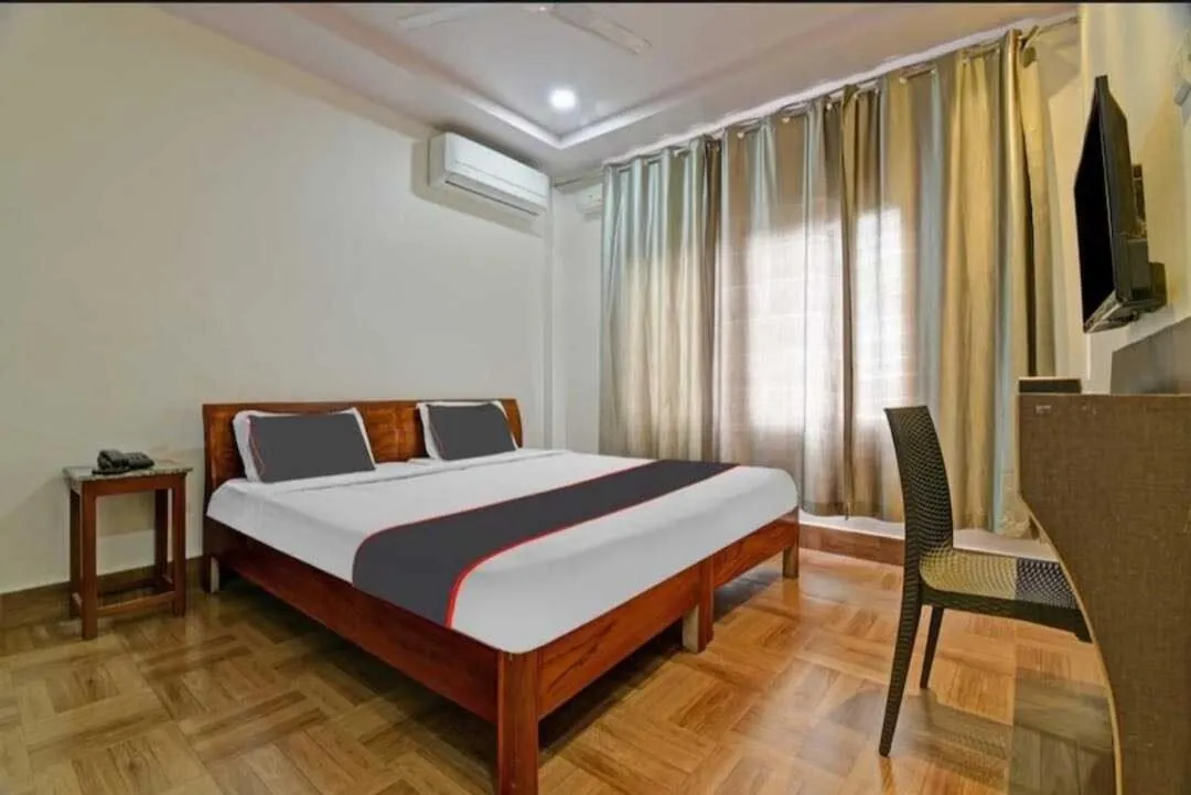 Bedroom in Collection O Megha Resort