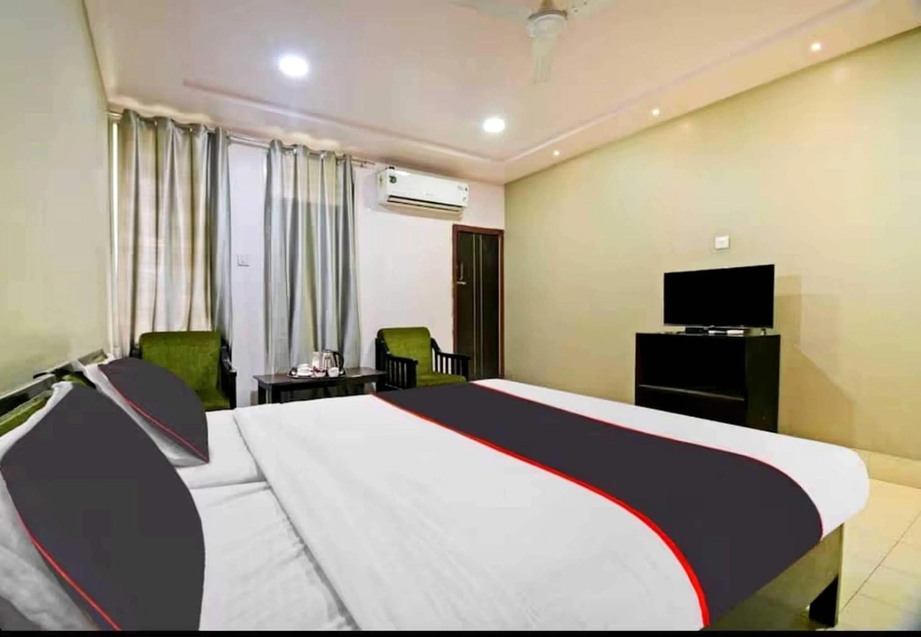 Bedroom in Collection O Megha Resort