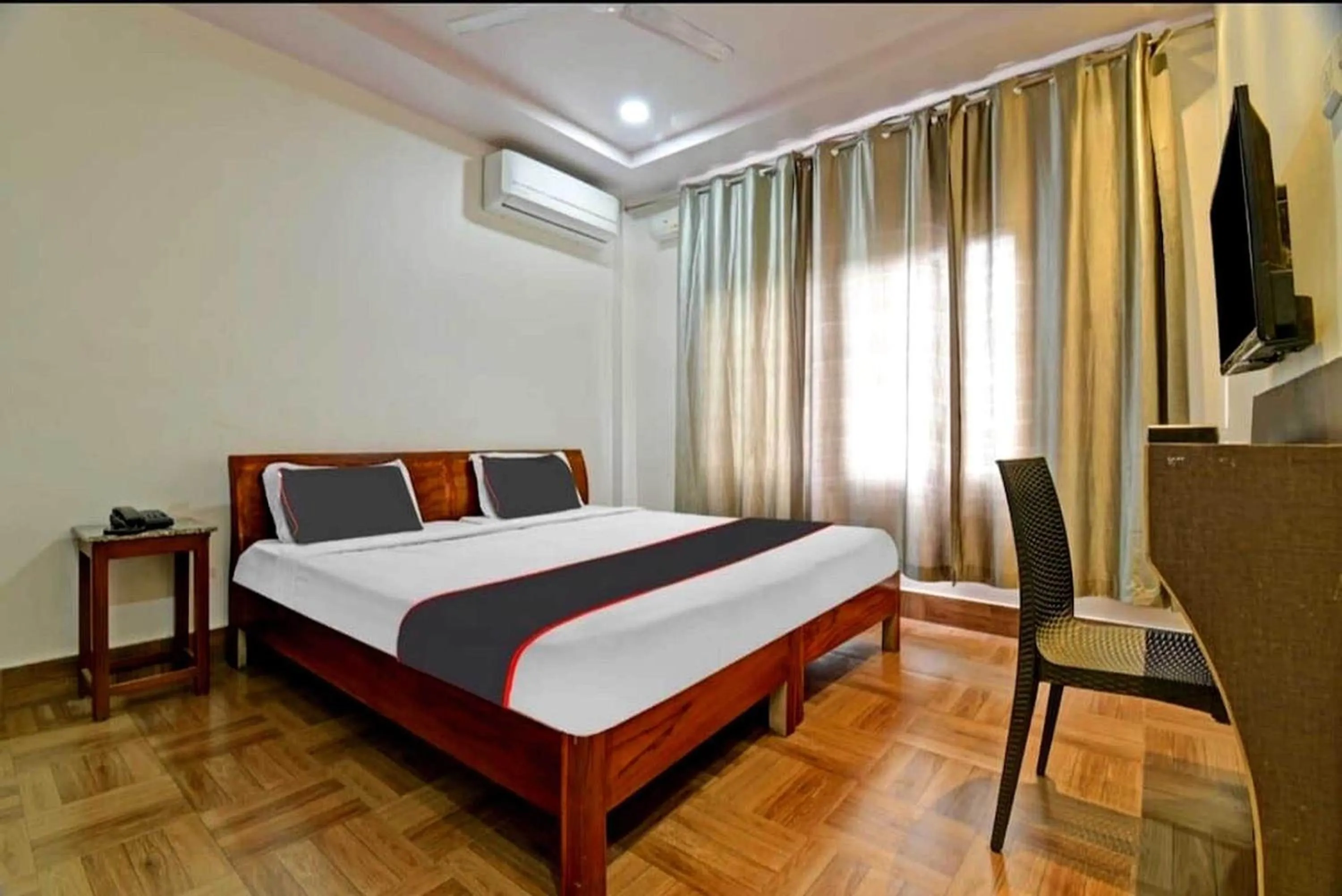 Bedroom in Collection O Megha Resort