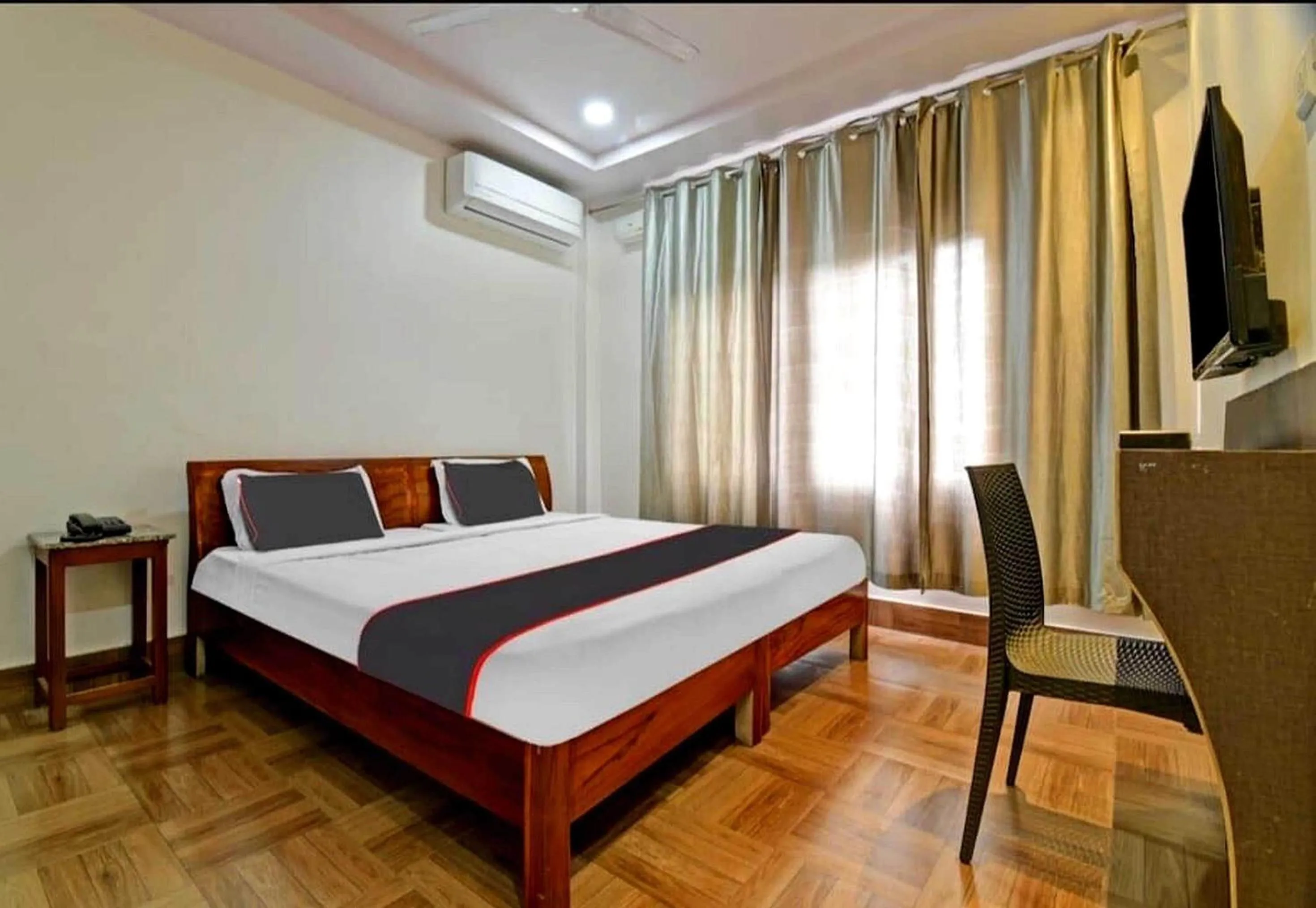 Bedroom in Collection O Megha Resort