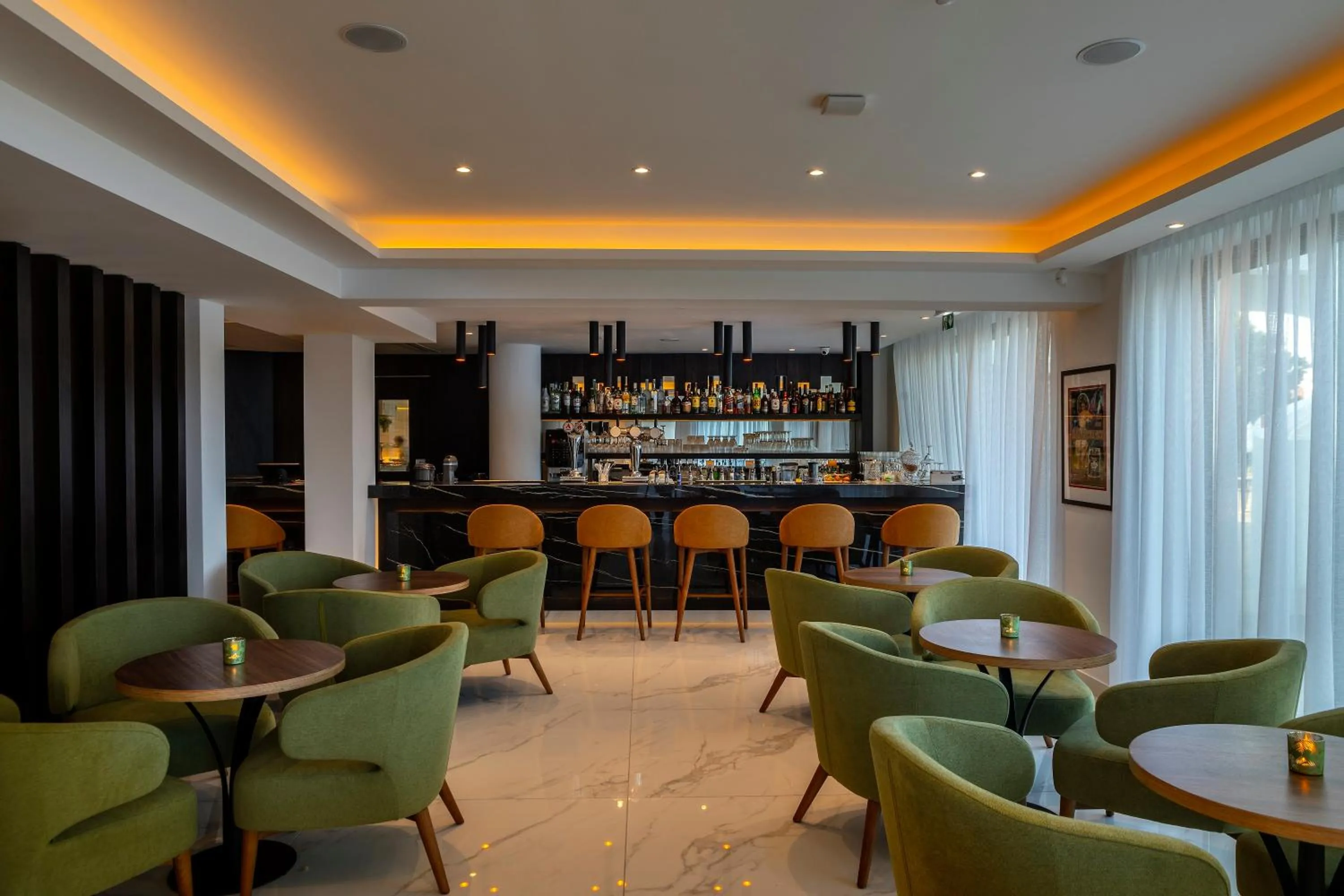 Lounge or bar in Leonardo Crystal Cove Hotel & Spa – Adults only