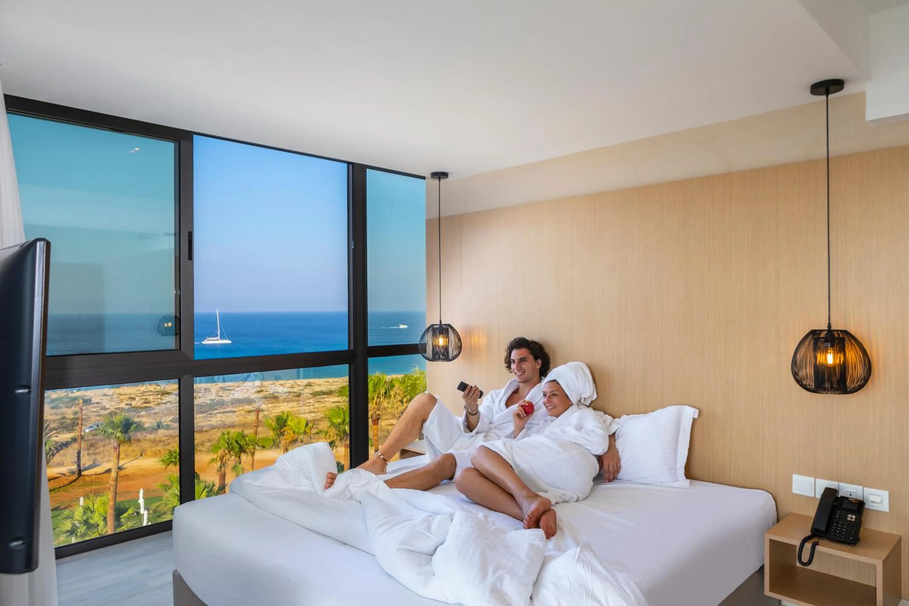 People, Bed in Leonardo Crystal Cove Hotel & Spa – Adults only