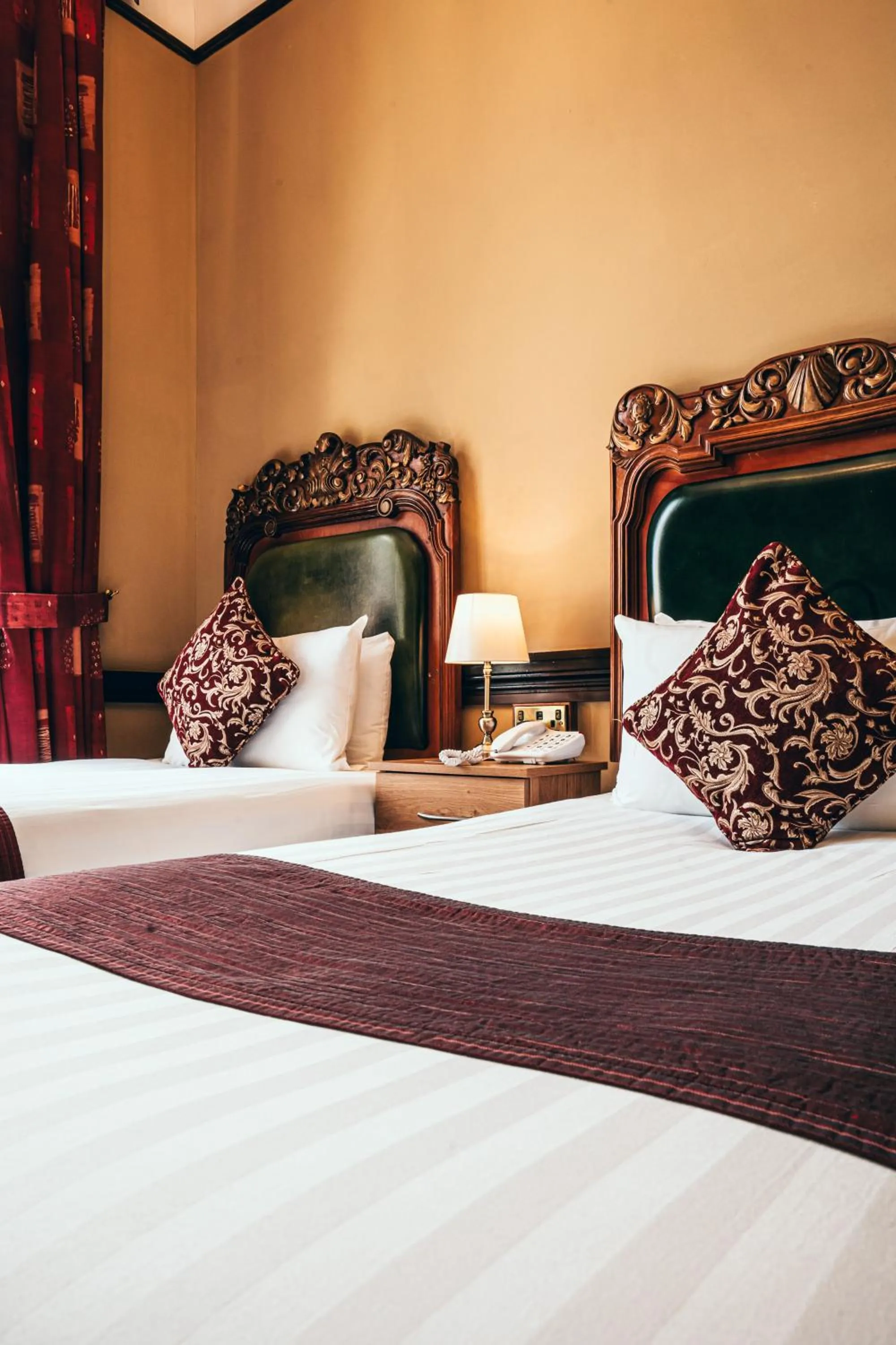 Bed in Russell Court Hotel